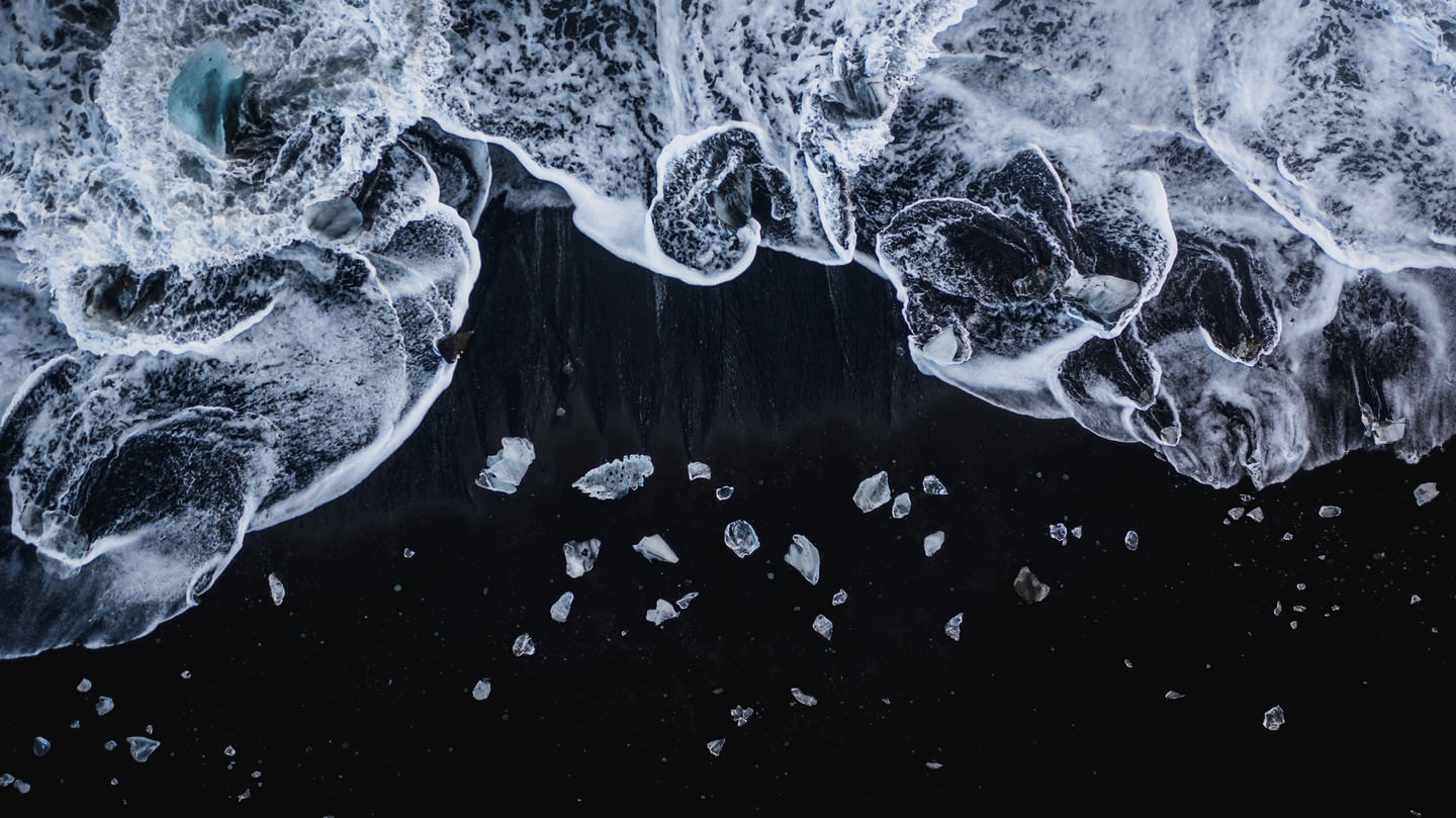 Aerial Photography of Black Sand Beach with Icebergs in Iceland by Jan Erik Waider