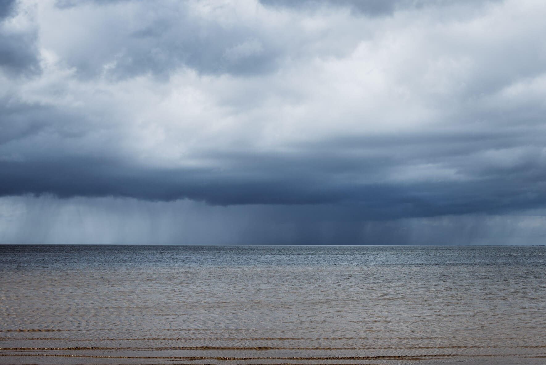 Dark rain clouds over the North Sea