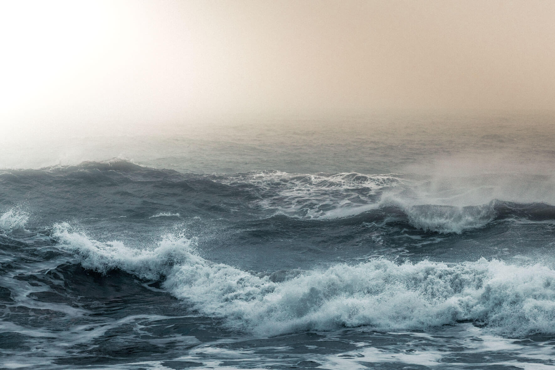 Morning light over waves at Reynisfjara beach in Iceland
