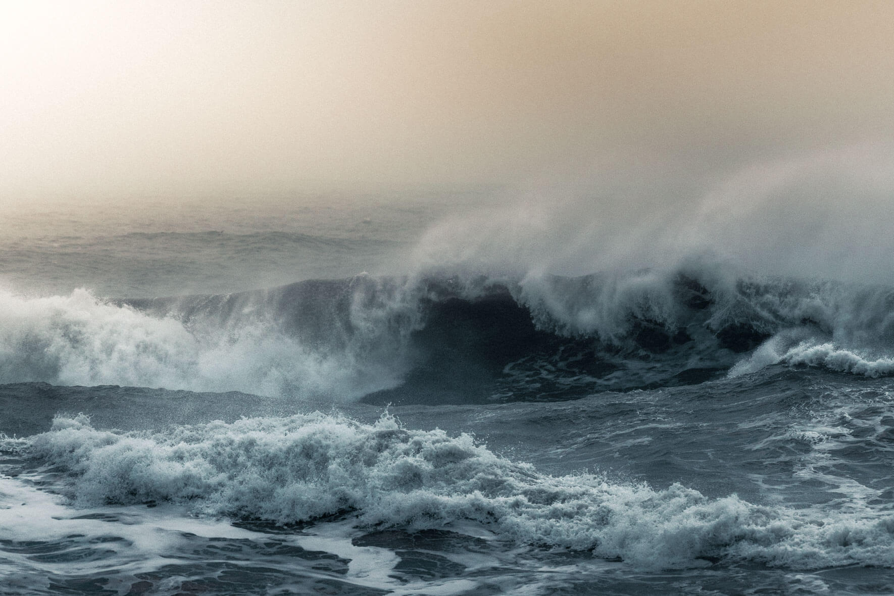 Morning light over waves at Reynisfjara beach in Iceland