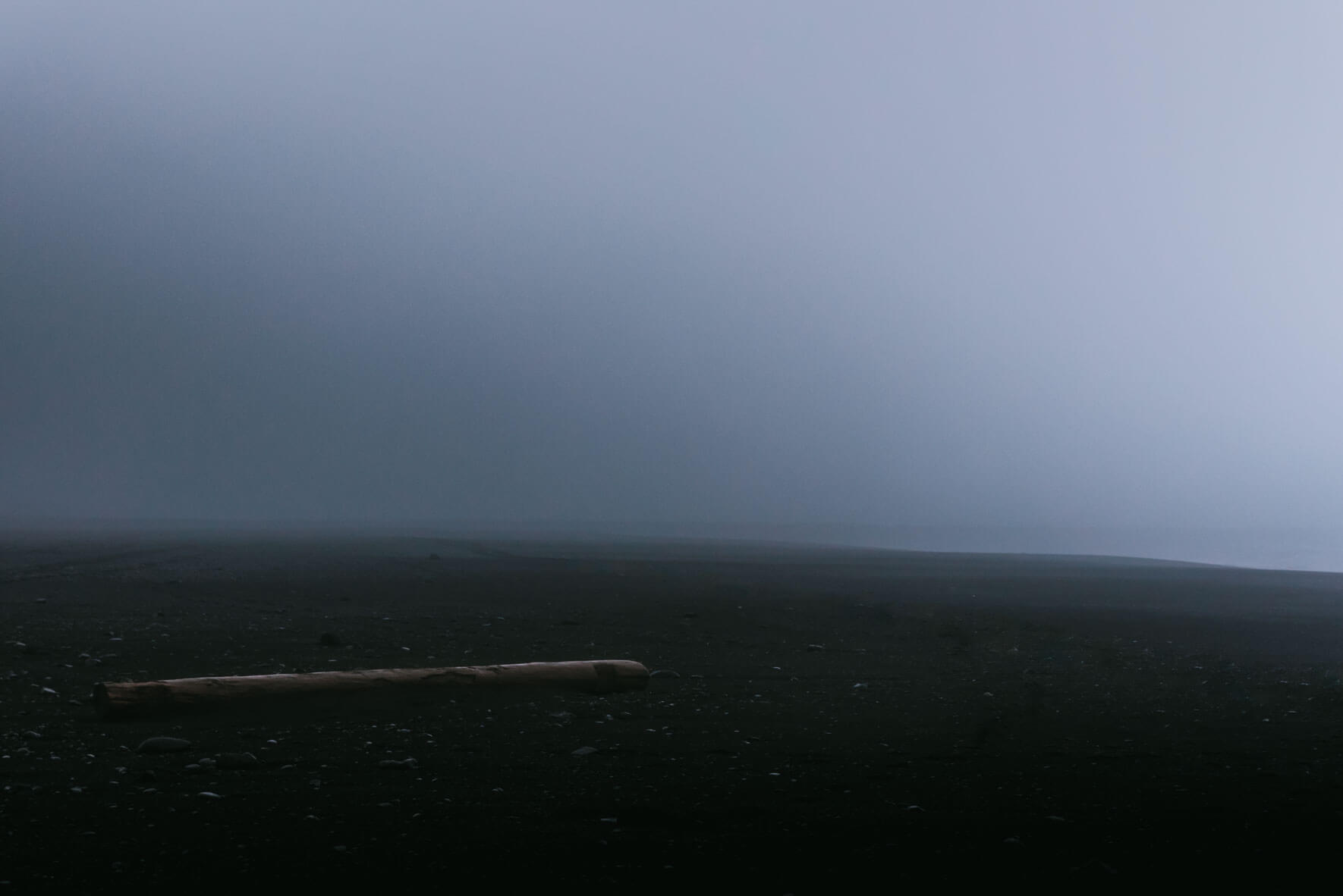 Foggy weather over black sand beach of Vík in Iceland