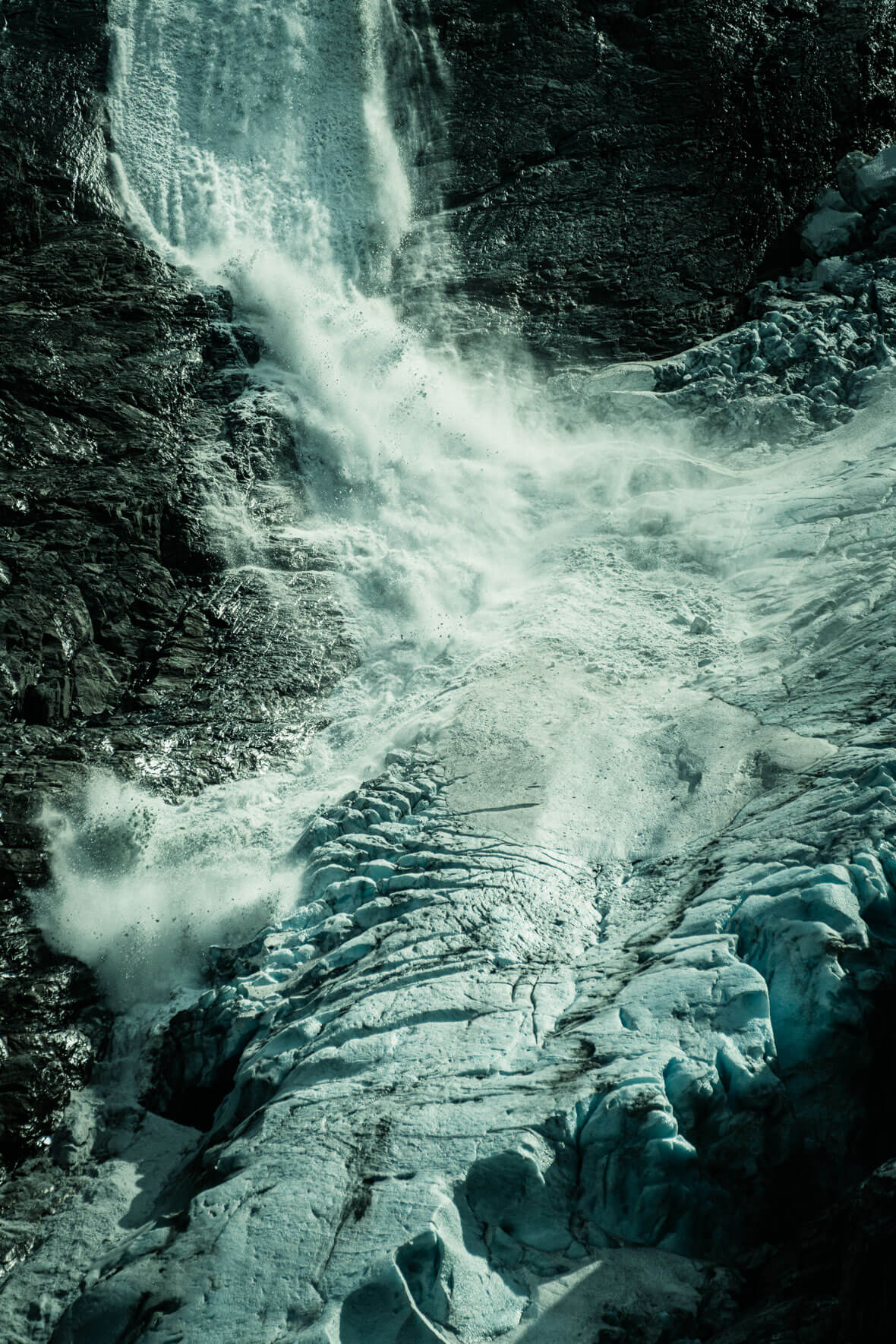 Ice avalanche at the Kjenndalsbreen glacier in Norway