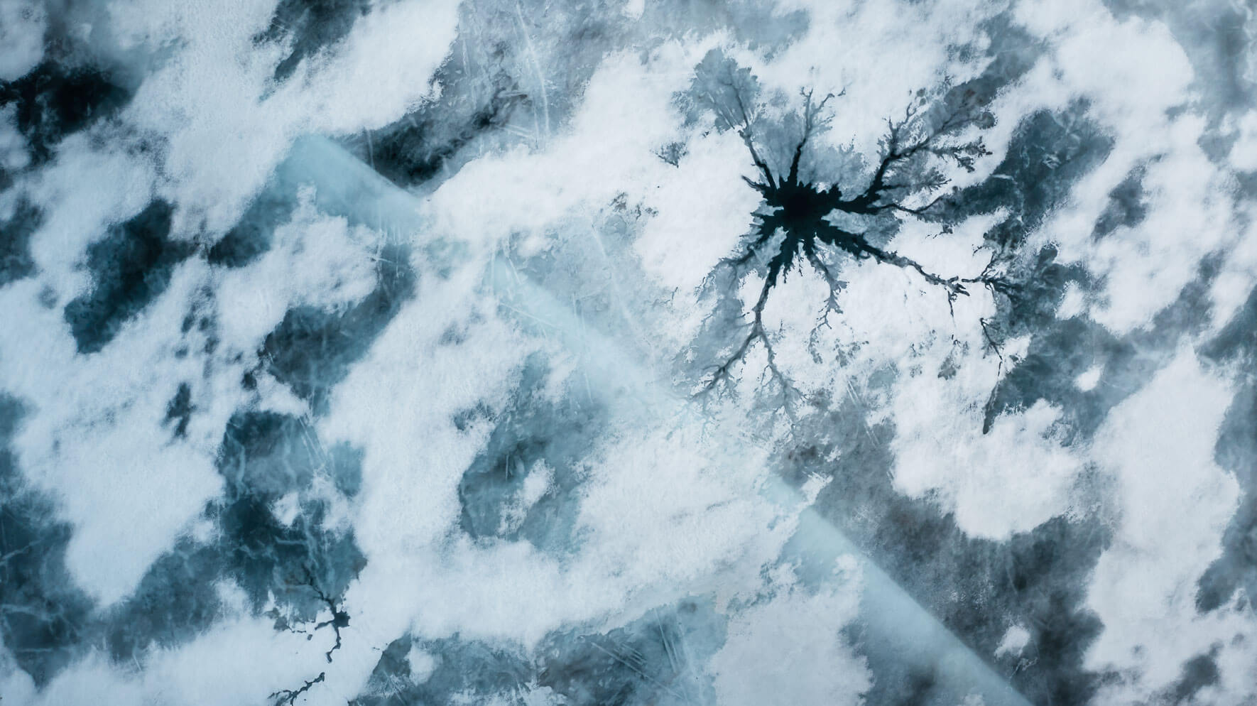 Aerial photography of a frozen lake in the Hardangervidda National Park in Norway