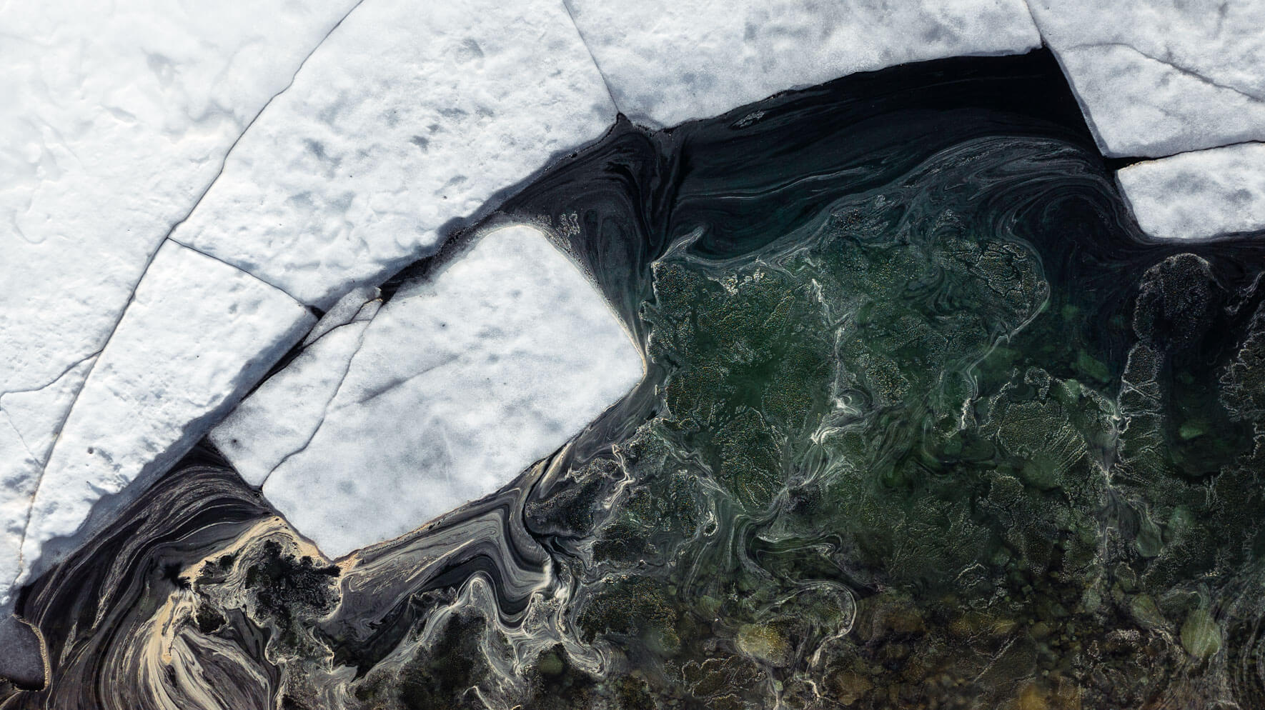 Aerial view of icebergs and pollen on lake Ståvatn in Norway