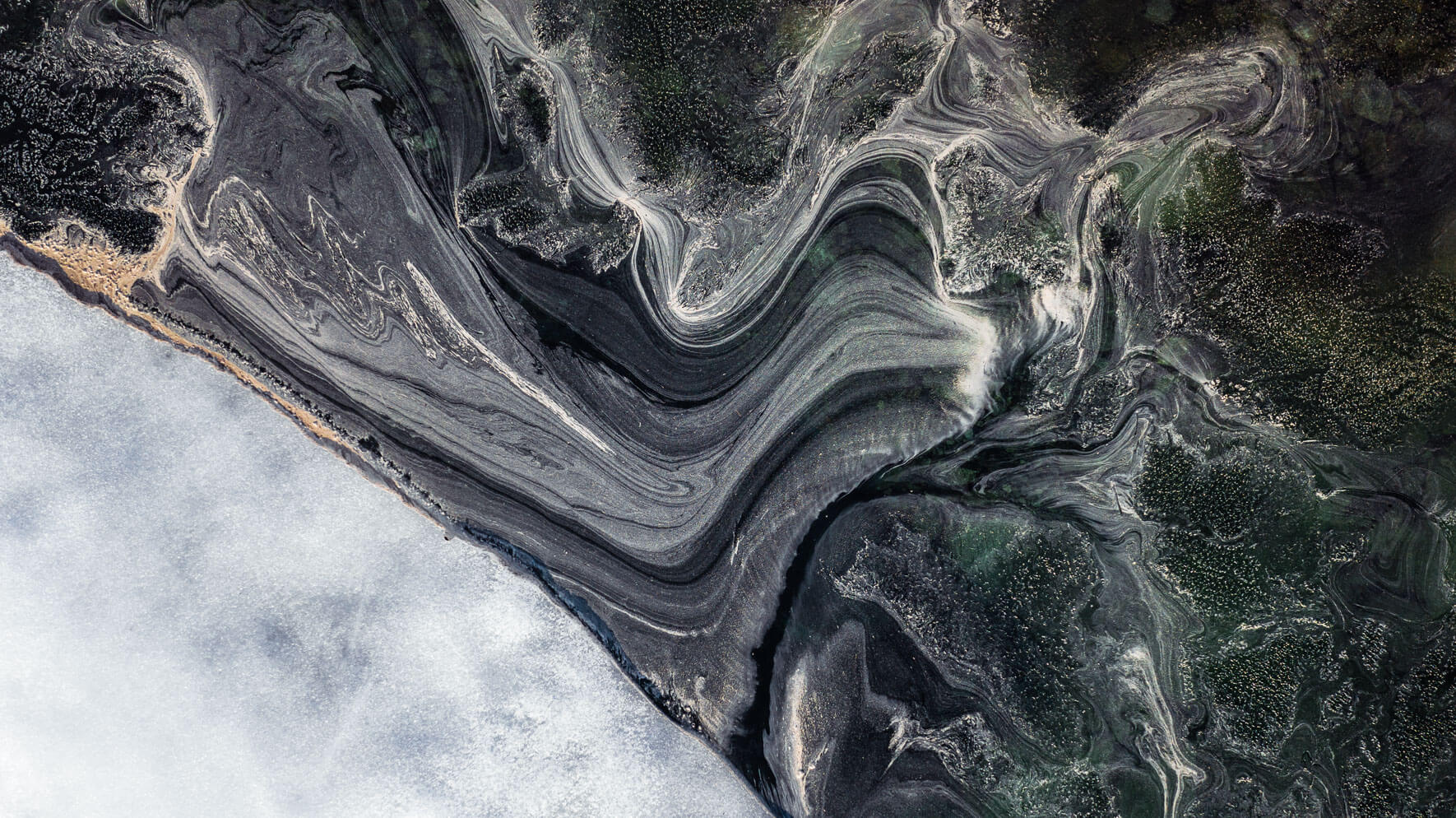 Aerial view of an iceberg and pollen on a lake in Norway