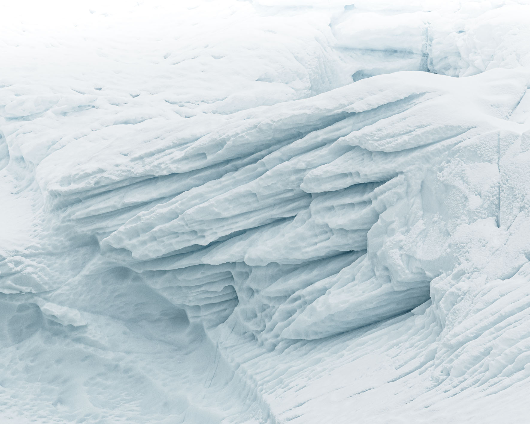 Surreal shapes and patterns of icebergs in Antarctica