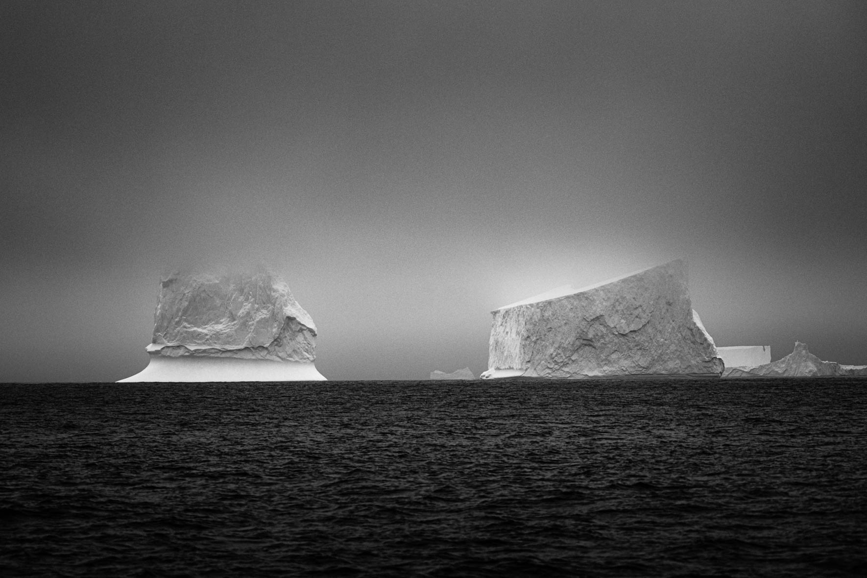 Tabular icebergs in the Gerlache Strait of Antarctica in black and white