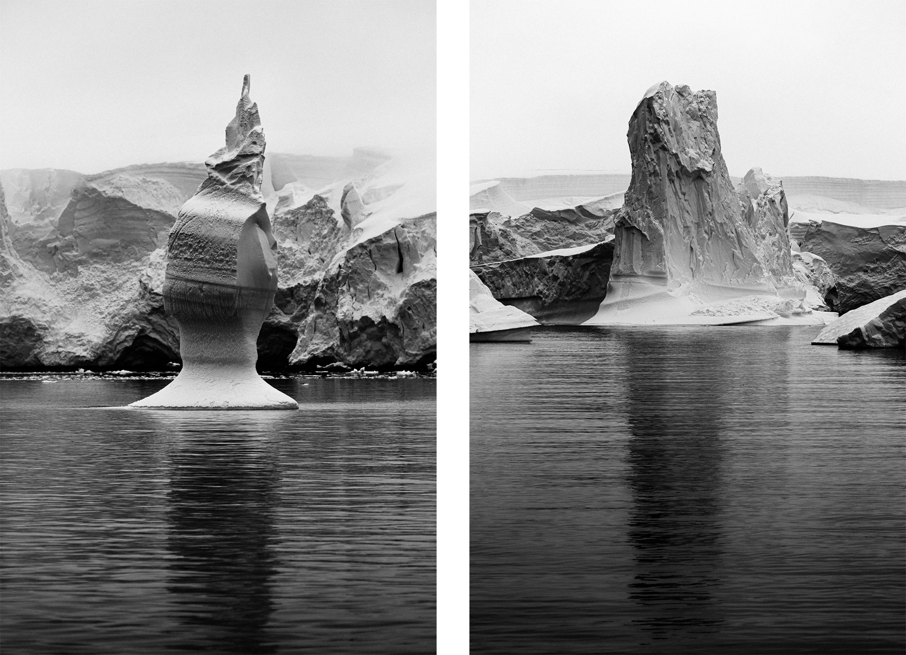 Surreal shapes of icebergs in Antarctica in black and white