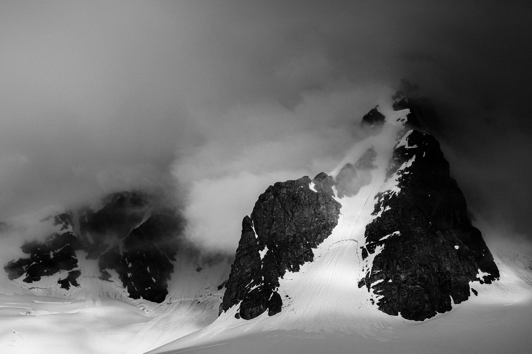Mountain in the clouds in Antarctica