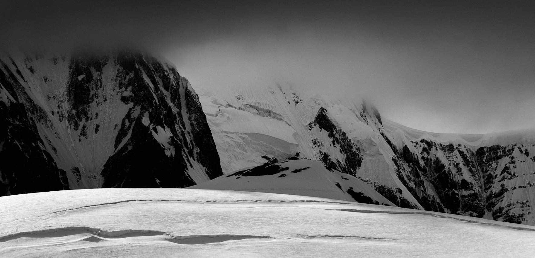 Glacier and Mountain in the clouds in Antarctica