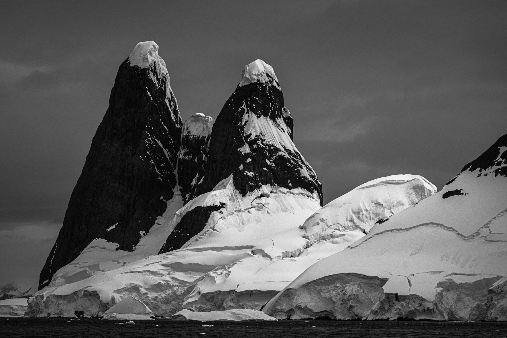 Snow-capped mountains on the Antarctic Peninsula with glaciers