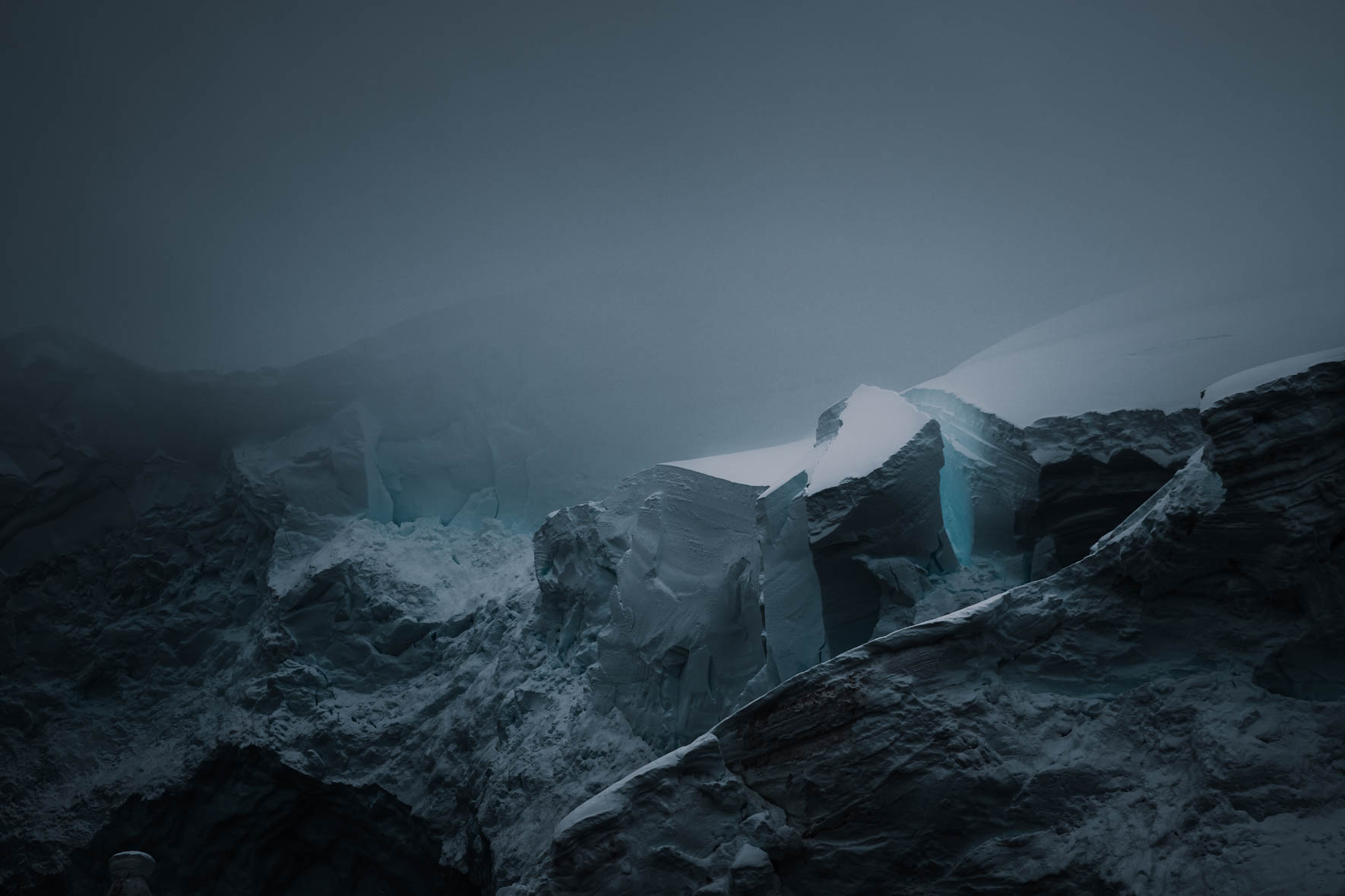 Dark and moody light over a glacier in Antarctica