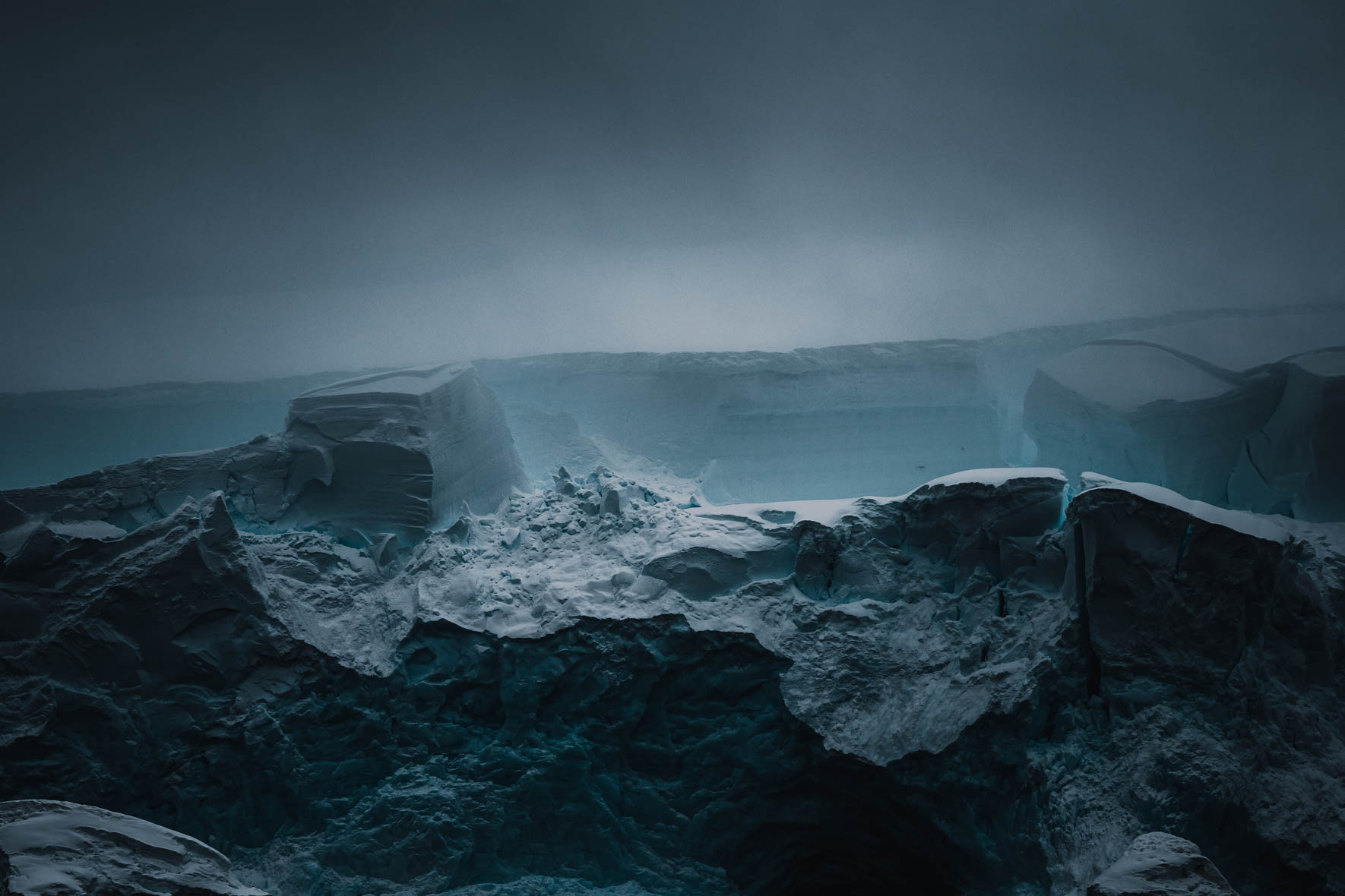 Dark and moody atmosphere over a glacier in Antarctica