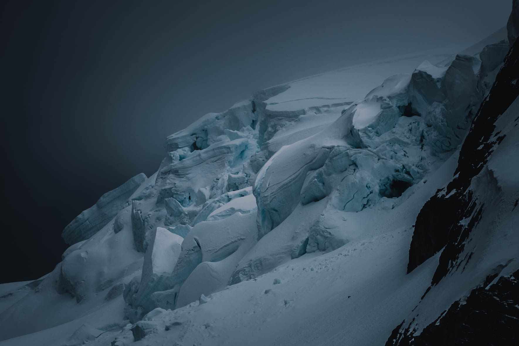 Dark clouds over glacier in Antarctica