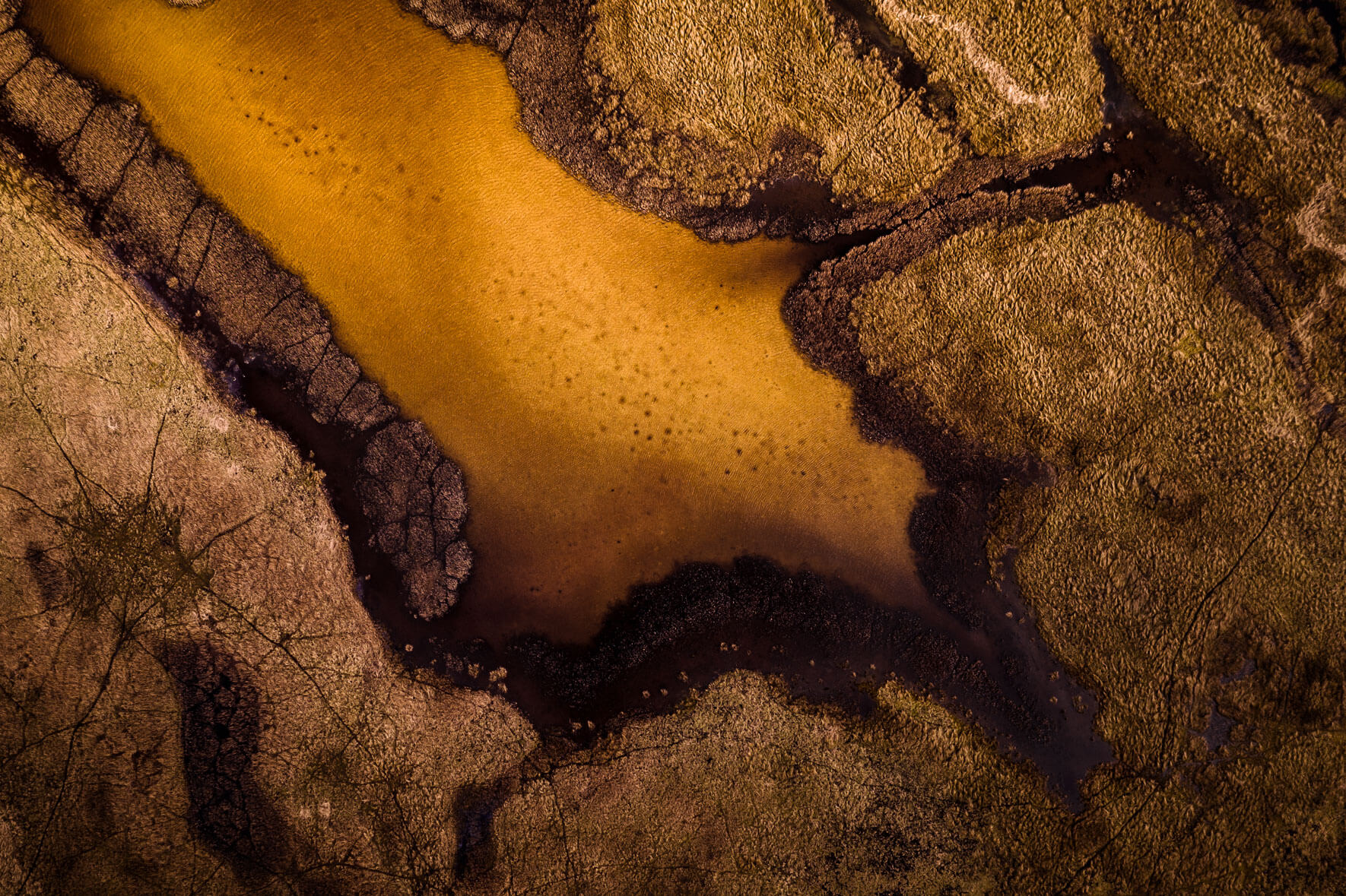 Abstract yellow lake from aerial perspective