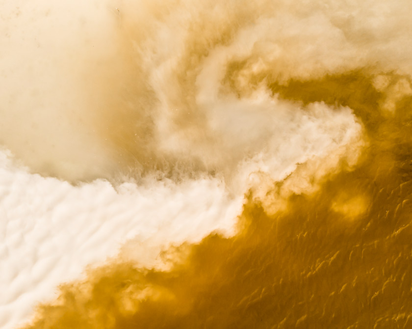 Yellow lake with flowing chalk water stream