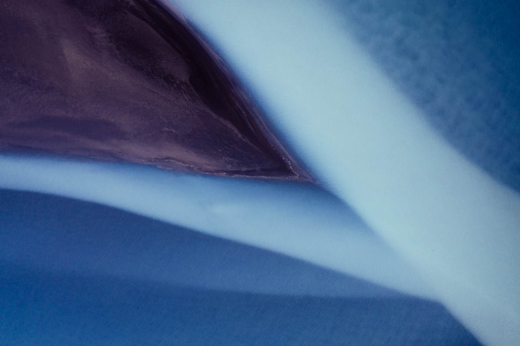 Aerial photography of glacial river in purple colors in Iceland