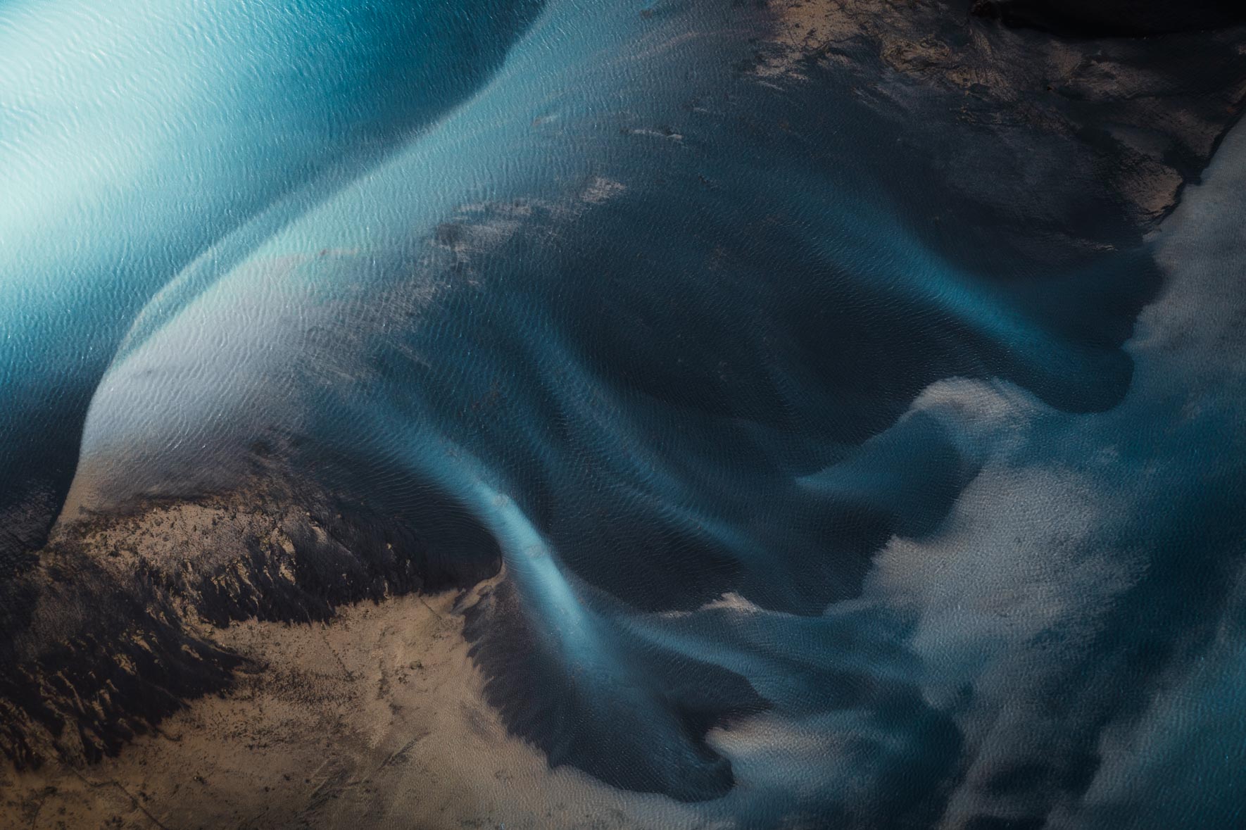 Glacier river in Iceland from the air with sand