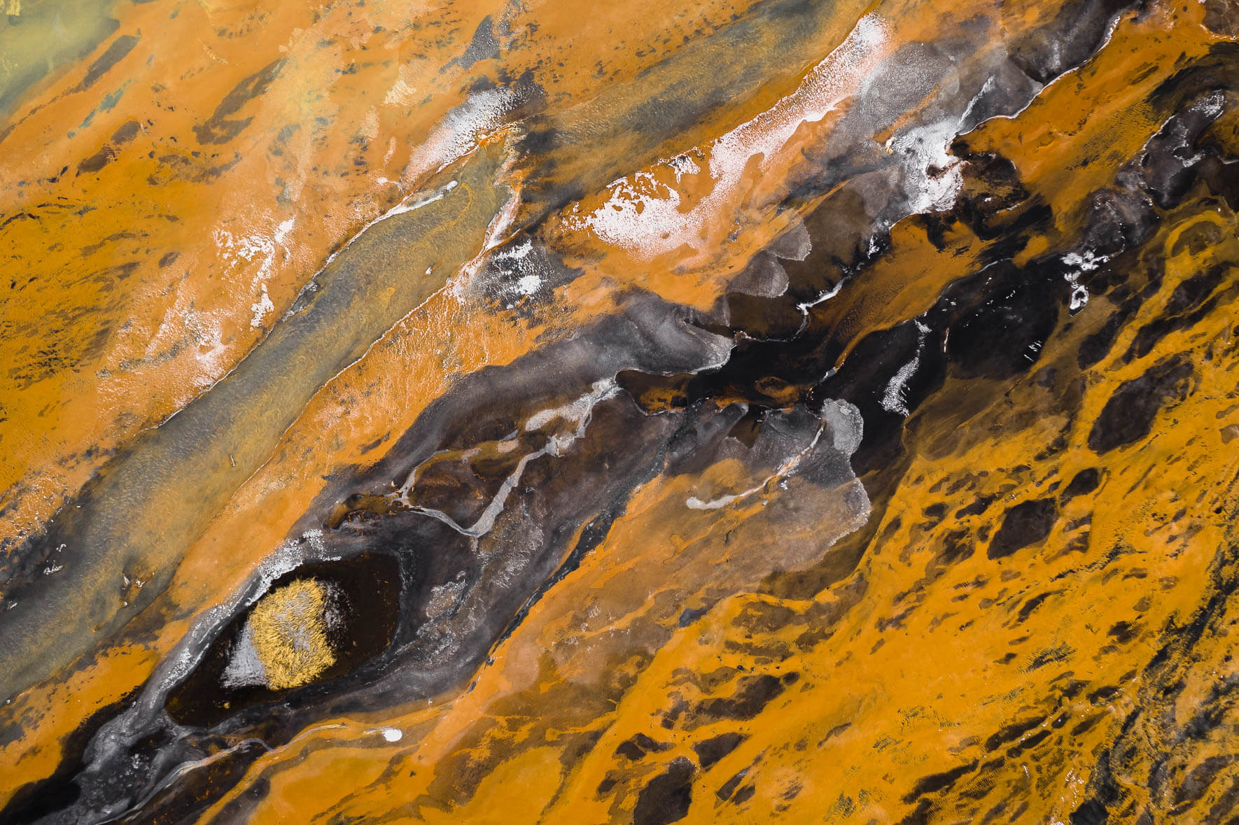 Surreal Aerial Winter Landscape of Iceland with Orange River and Ice