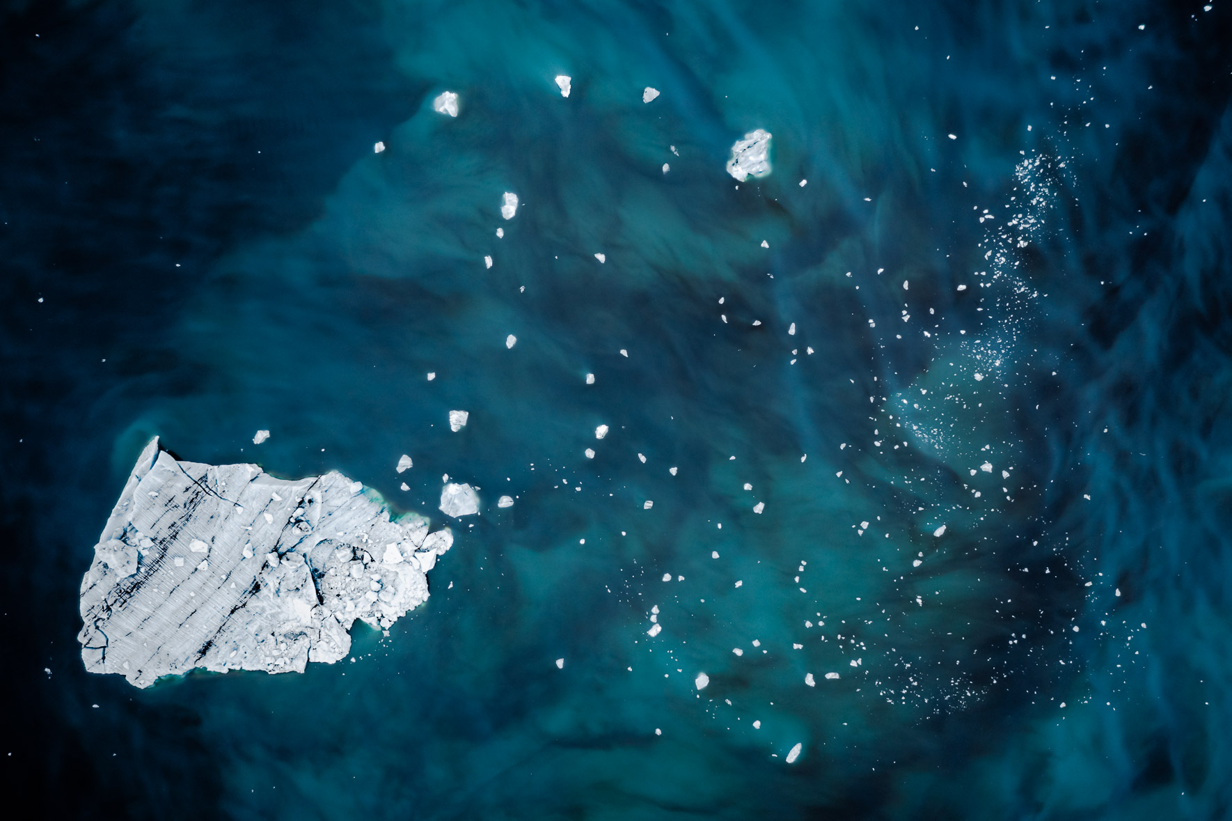 Aerial photography of icebergs floating in a glacier lagoon