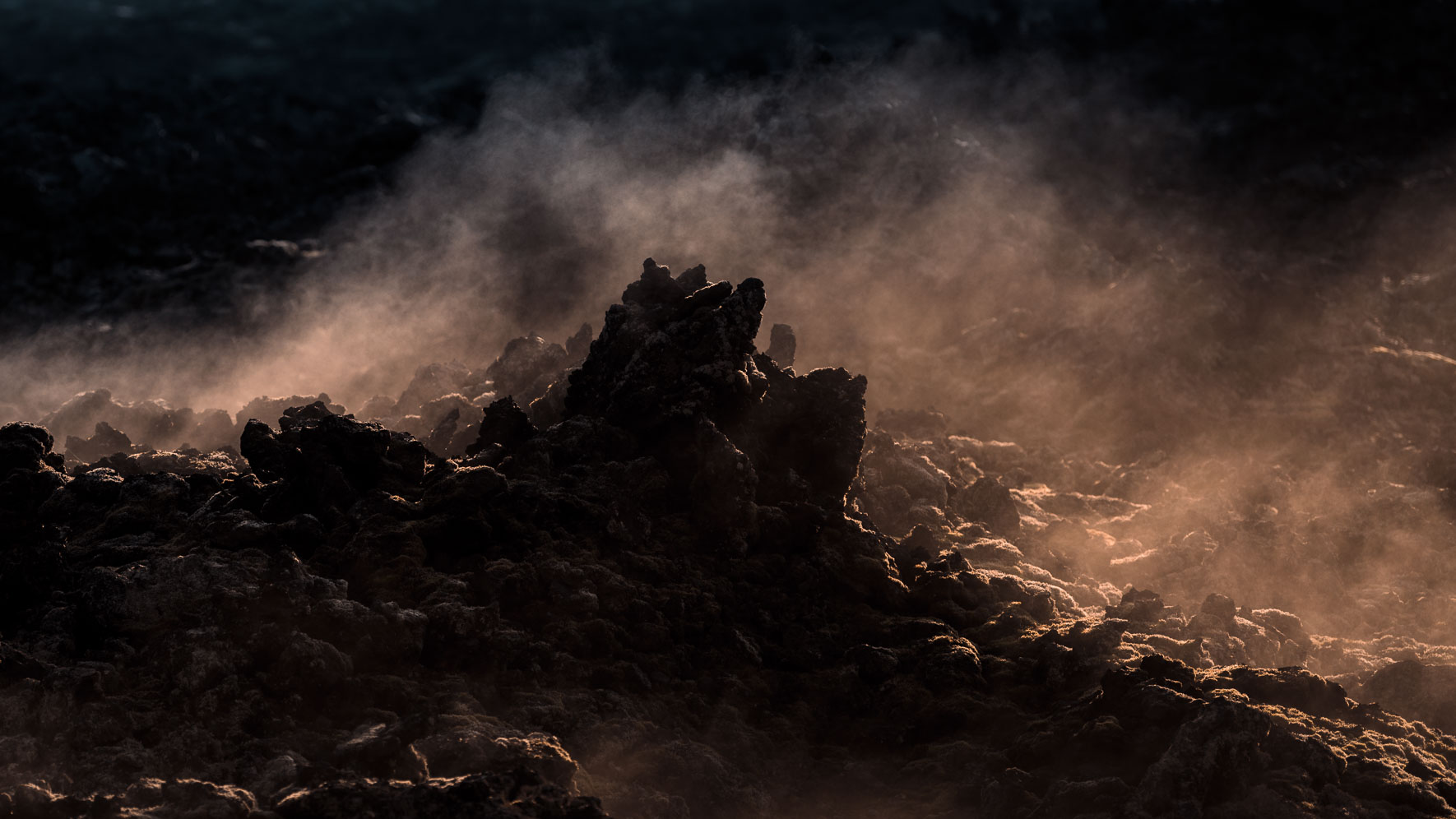 Volcanic Rocks with Steam of Krafla Lava Fields in Iceland