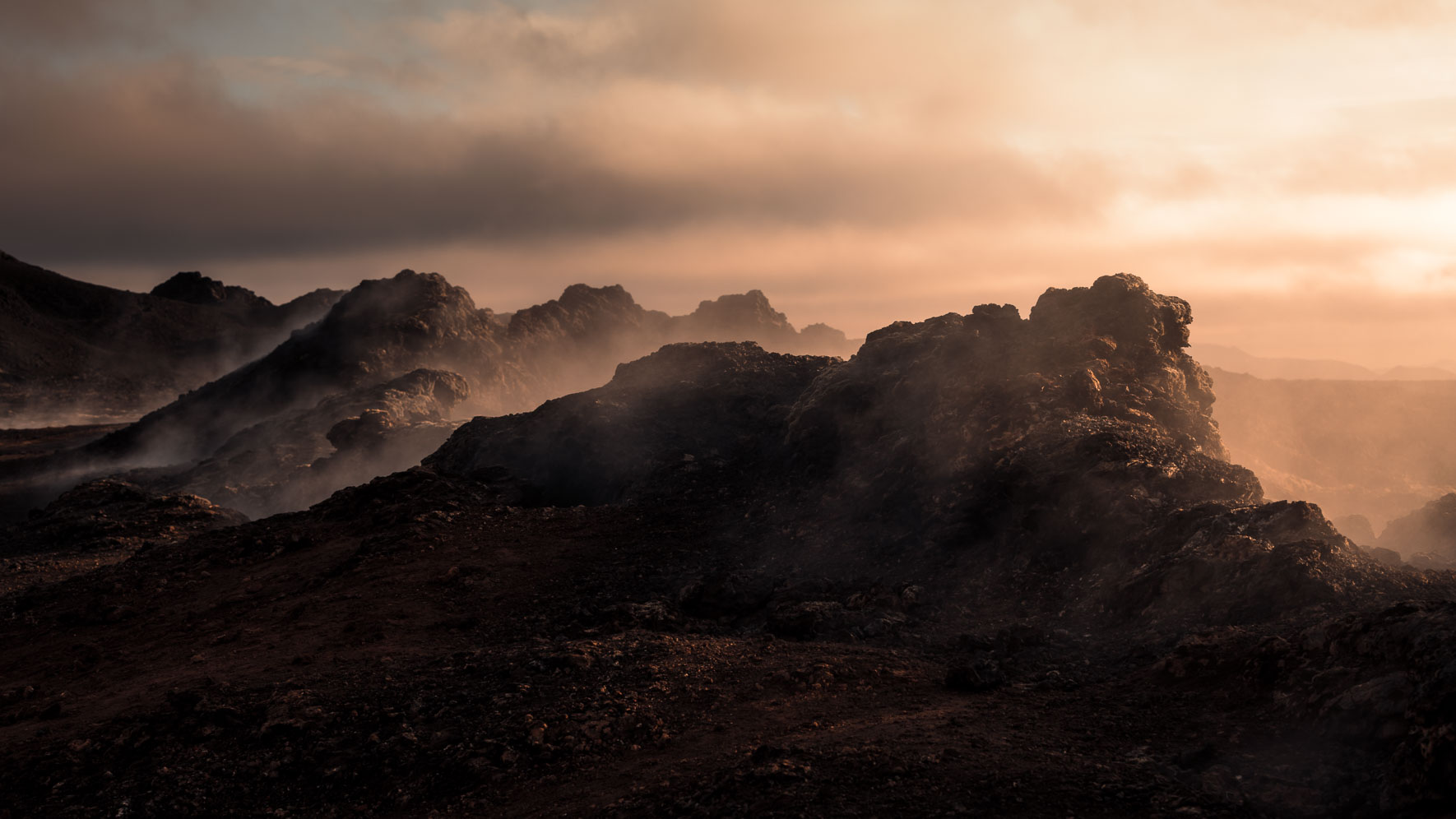 Rocks with Steam from Krafla Lava Fields In Iceland
