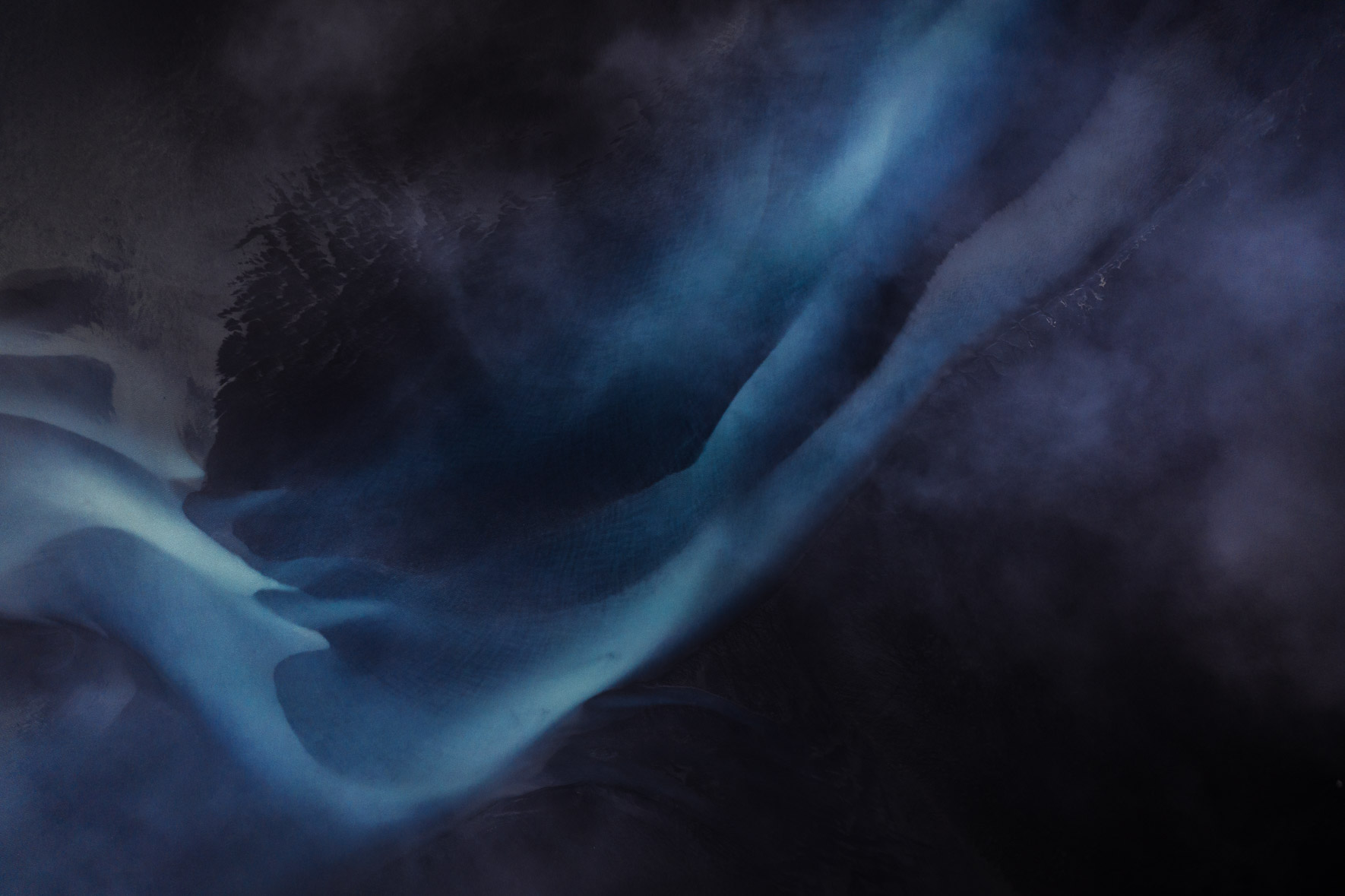 Dark and Moody Aerial Photography of Glacier River in Iceland