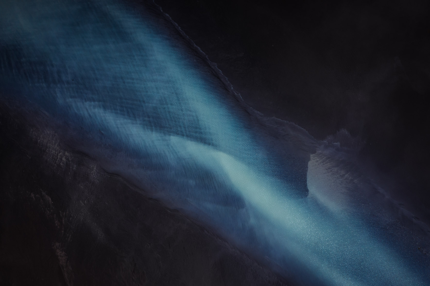 Aerial Photography of Glacier River Patterns in Iceland