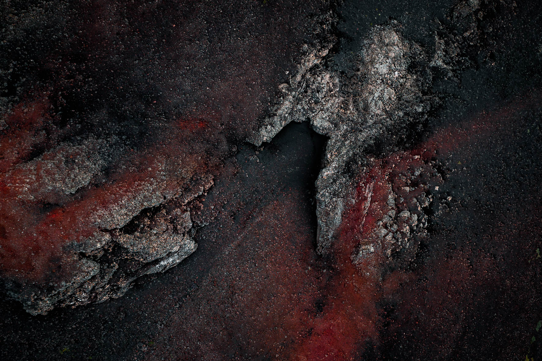 Remnants of Volcanic Craters in Iceland with Black and Red Sand