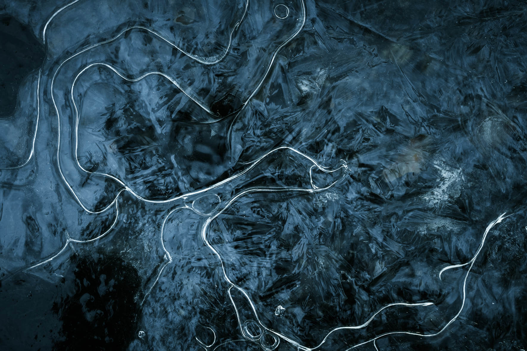 Abstract macro shot of puddle with frozen structures on the surface