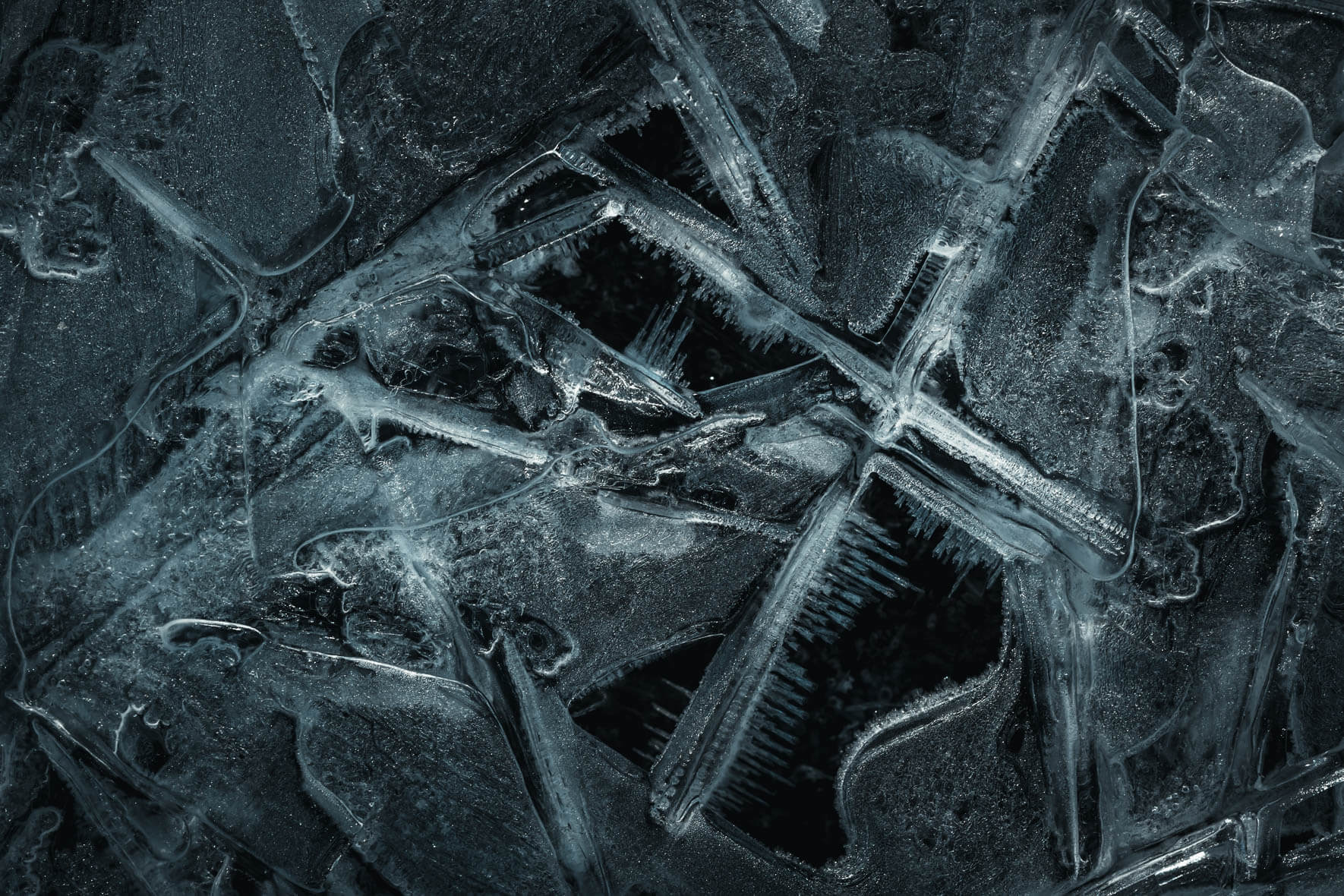 Macro photography of frozen puddle with abstract ice structures