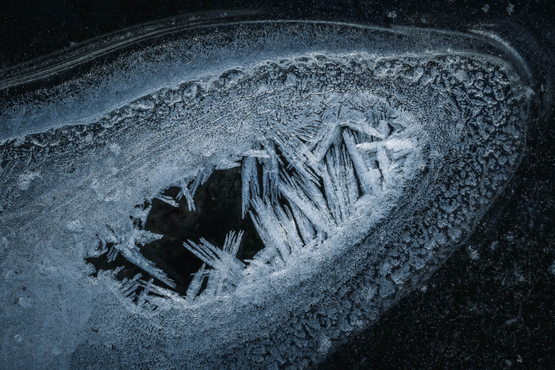 Abstract photograph of a frozen puddle with ice crystals