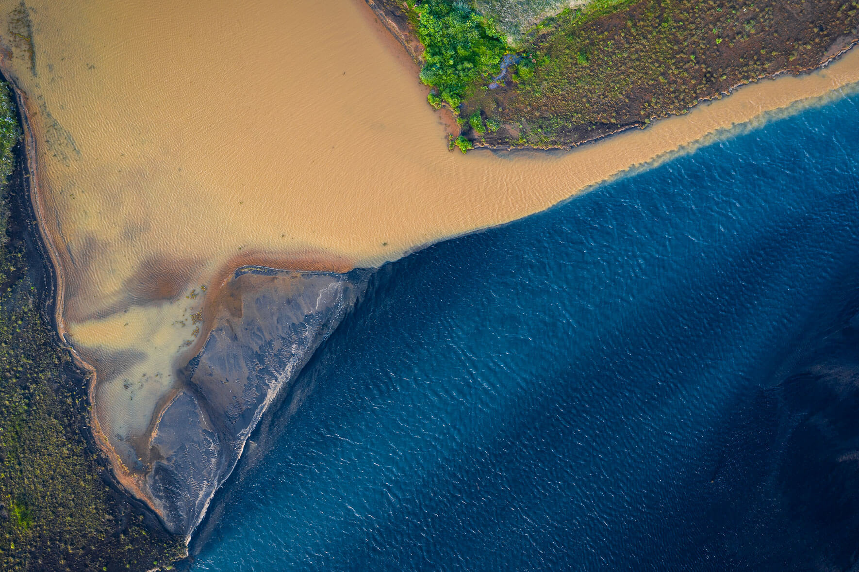 Holsa river near its mouth into the Atlantic Ocean on the south coast of Iceland