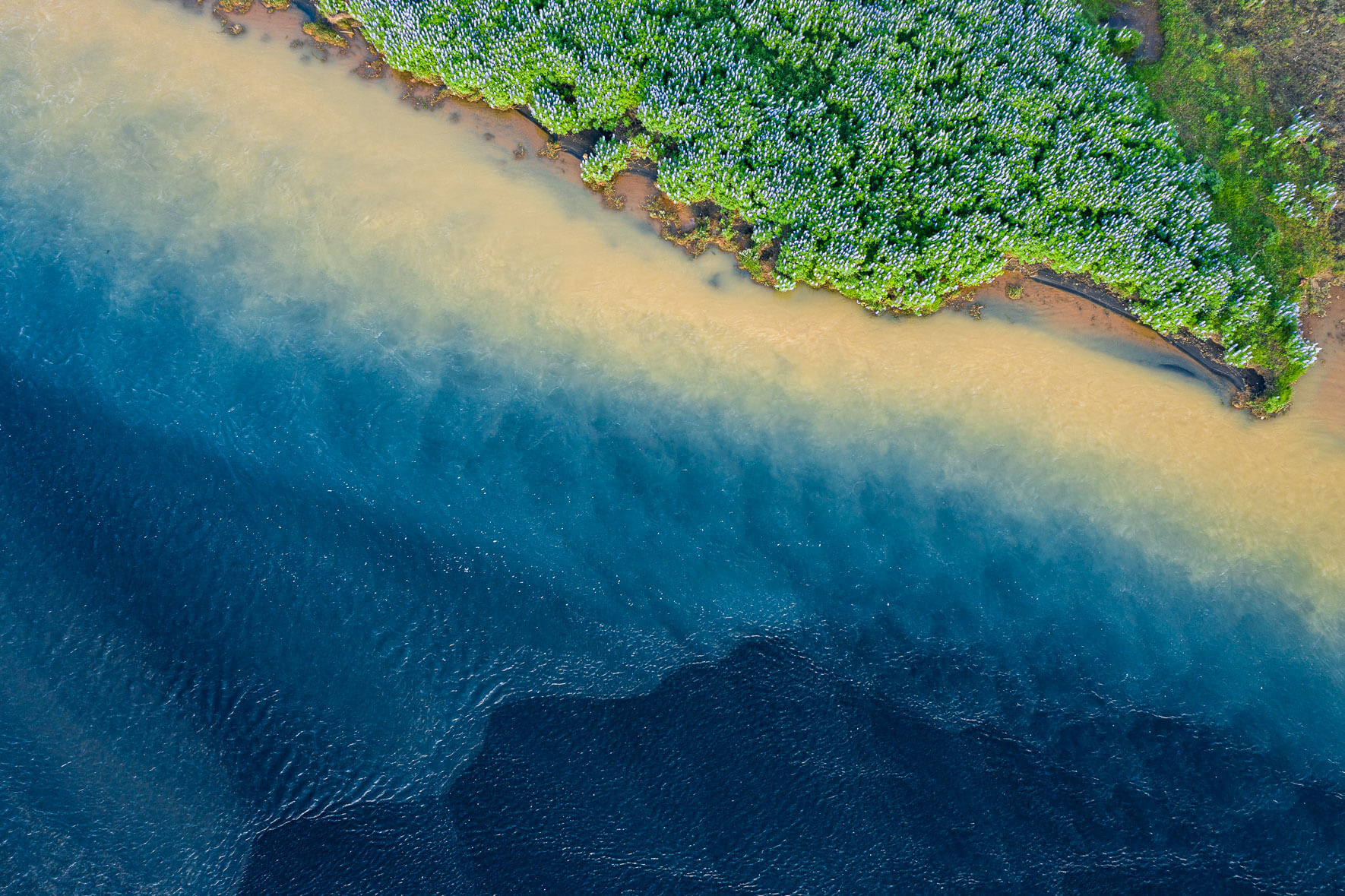 Holsa river near its mouth into the Atlantic Ocean on the south coast of Iceland