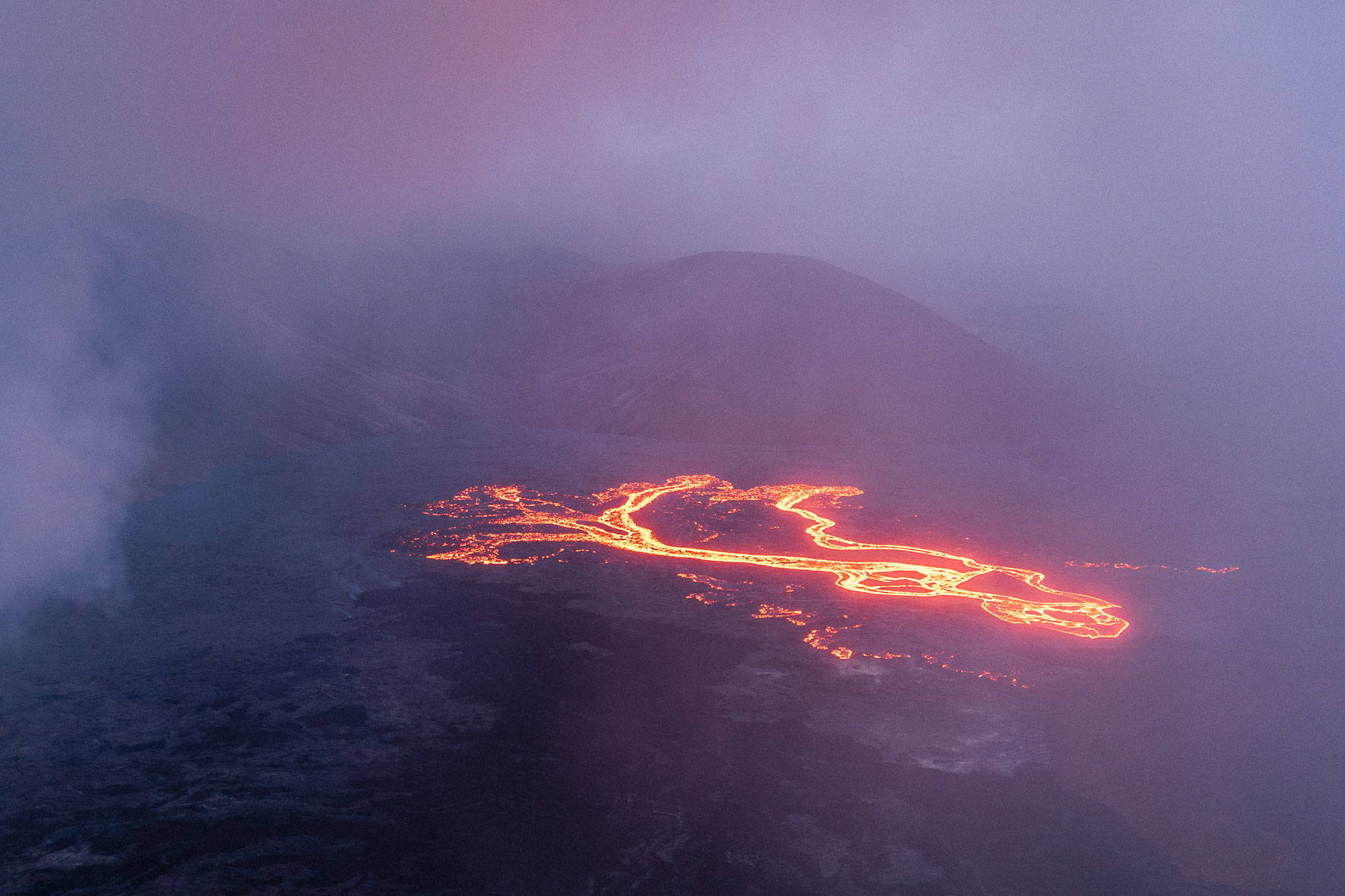 Lava rives at the Fagradalsfjall volcano in Iceland at night