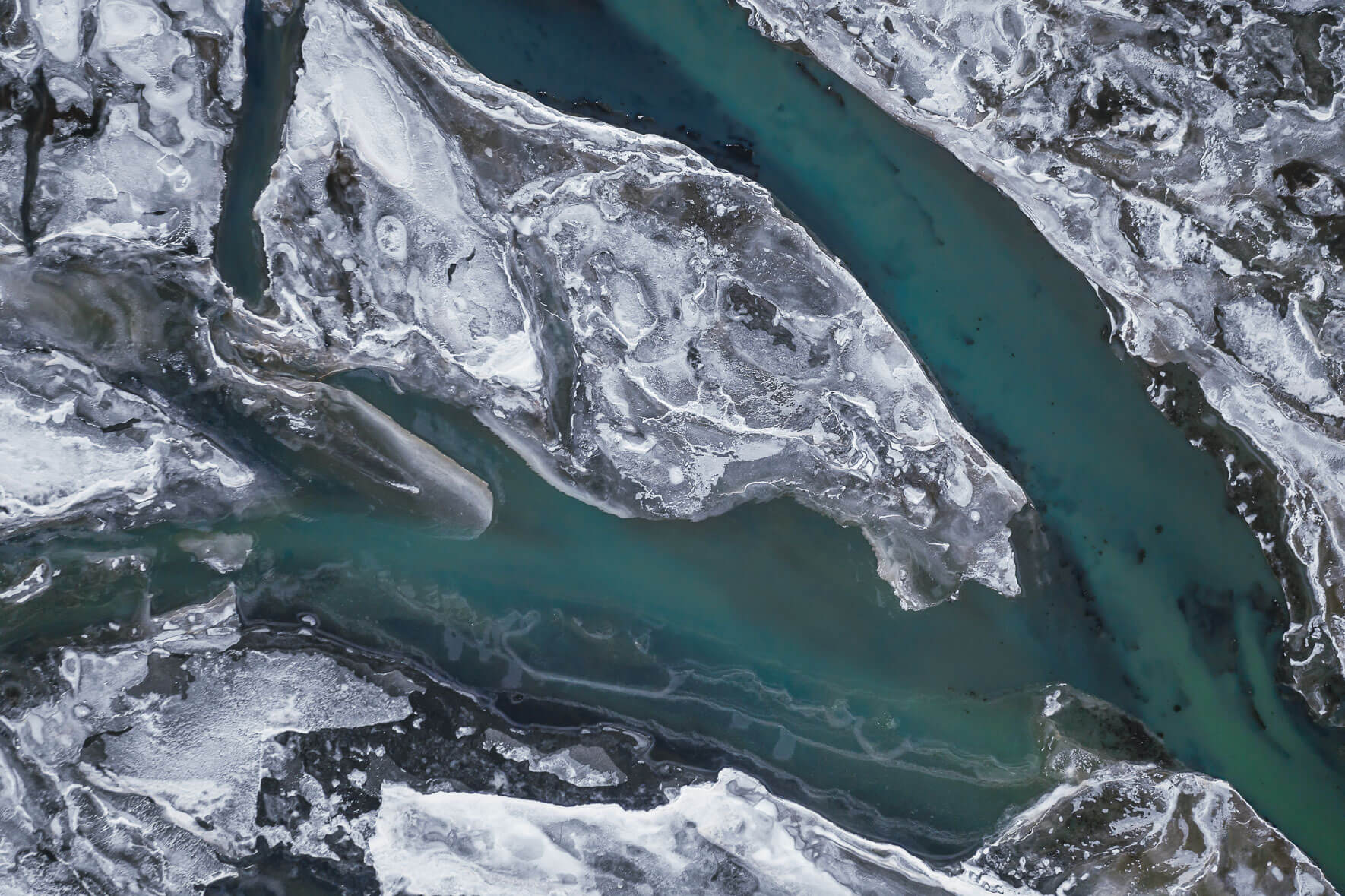 River Þjórsá on the south coast of Iceland in winter with frozen river banks