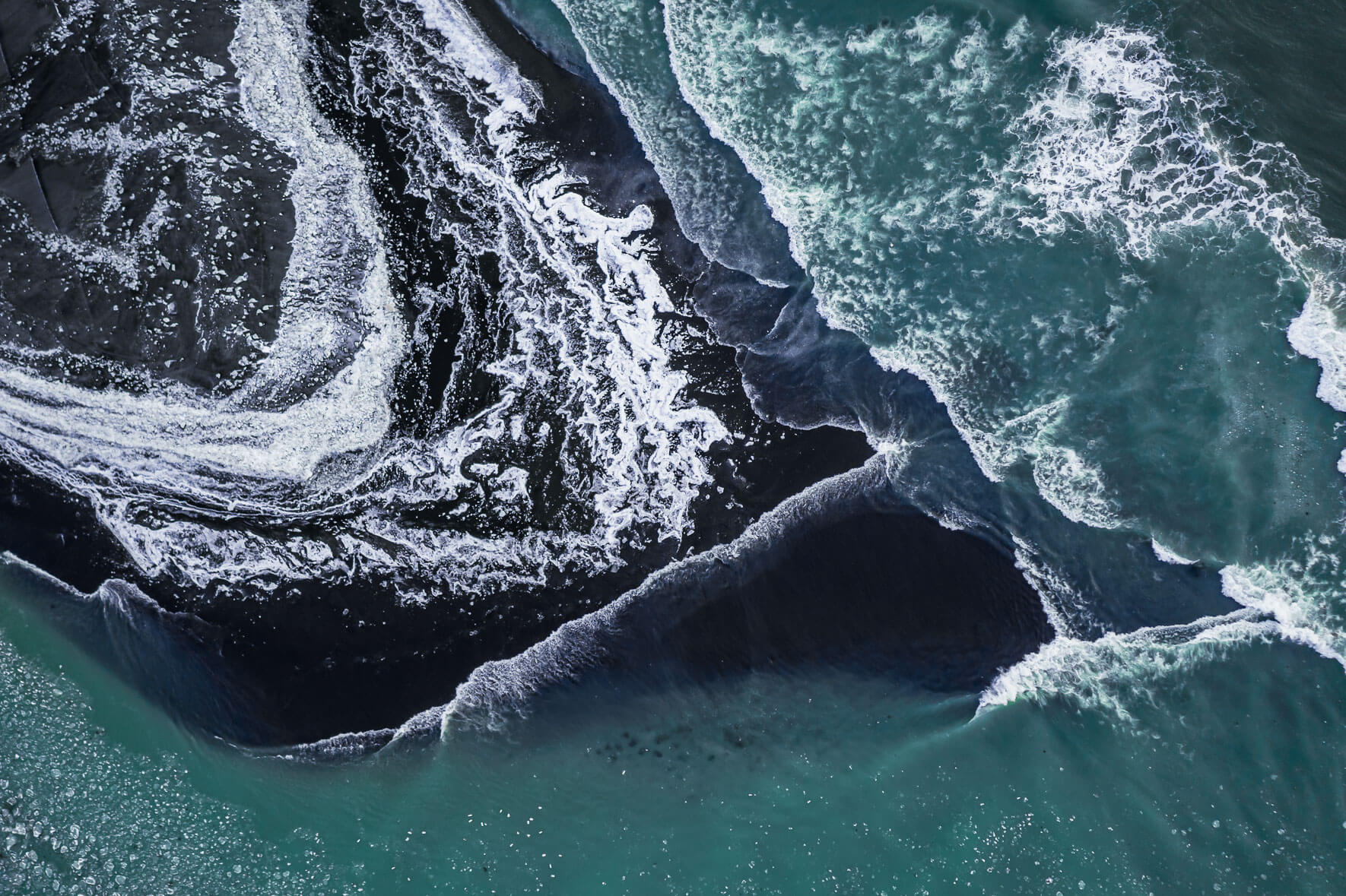 Glacier river in winter flowing into the Atlantic ocean in Iceland