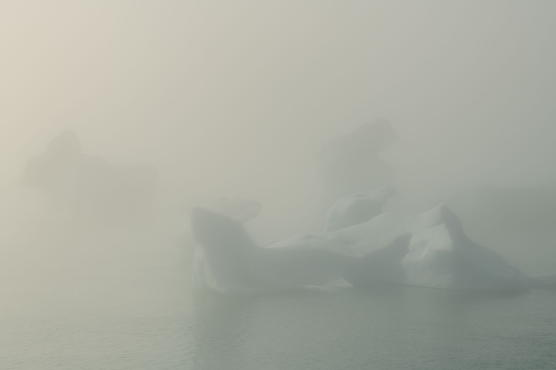 Icebergs in Jökulsárlón glacier lagoon in Iceland surrounded by dense fog