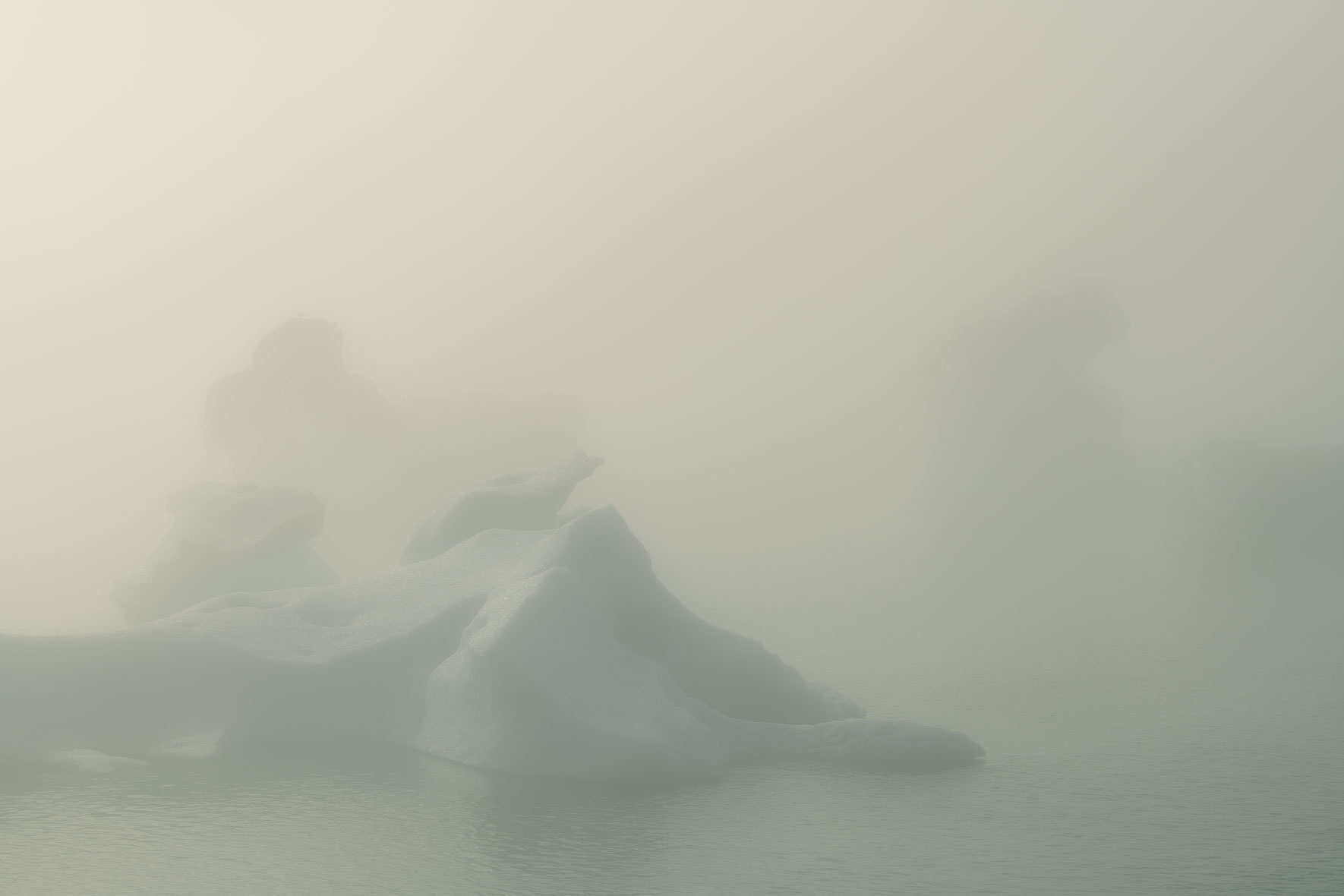 Icebergs in Jökulsárlón glacier lagoon in Iceland surrounded by dense fog