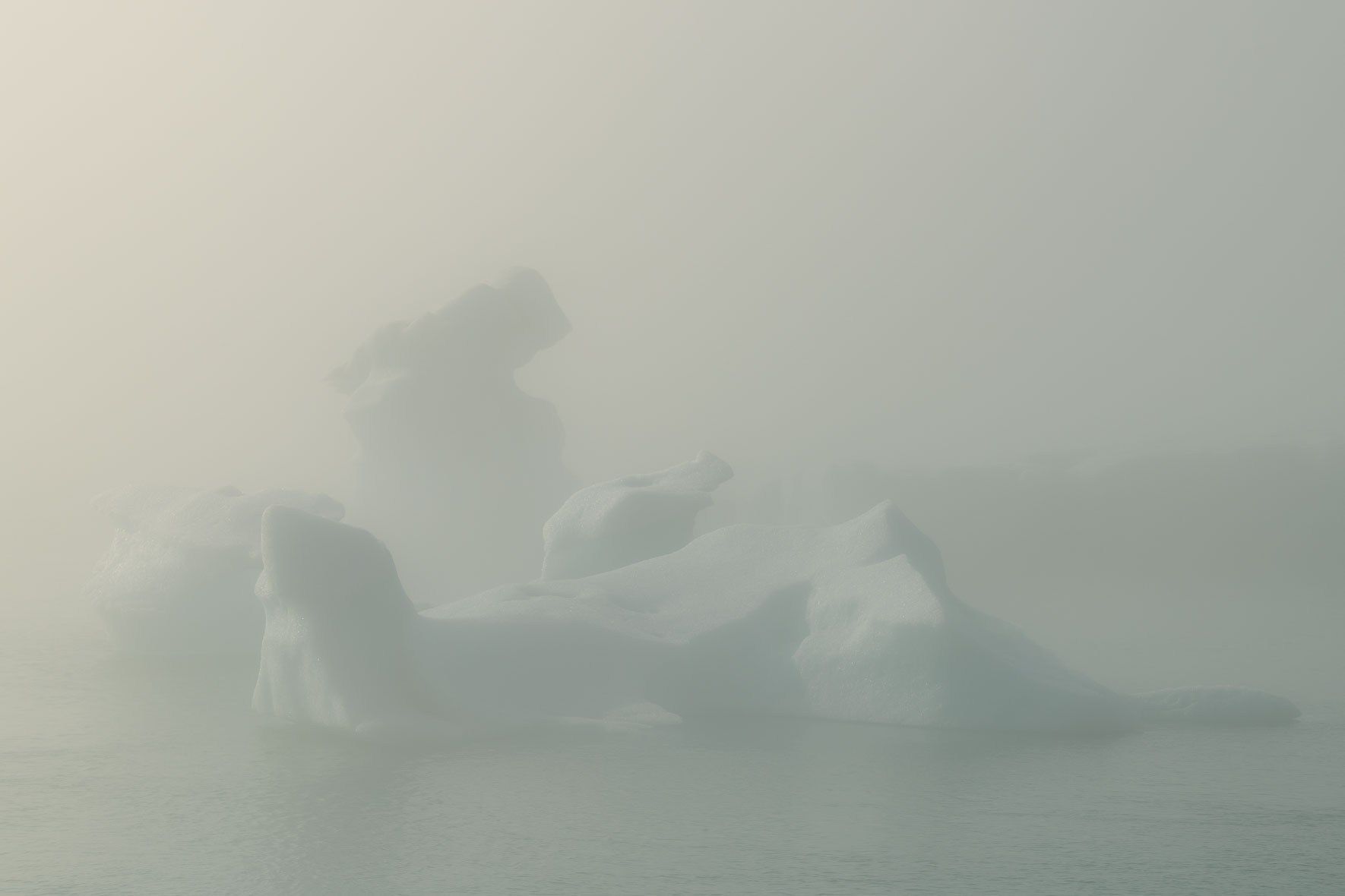 Icebergs in Jökulsárlón glacier lagoon in Iceland surrounded by fog