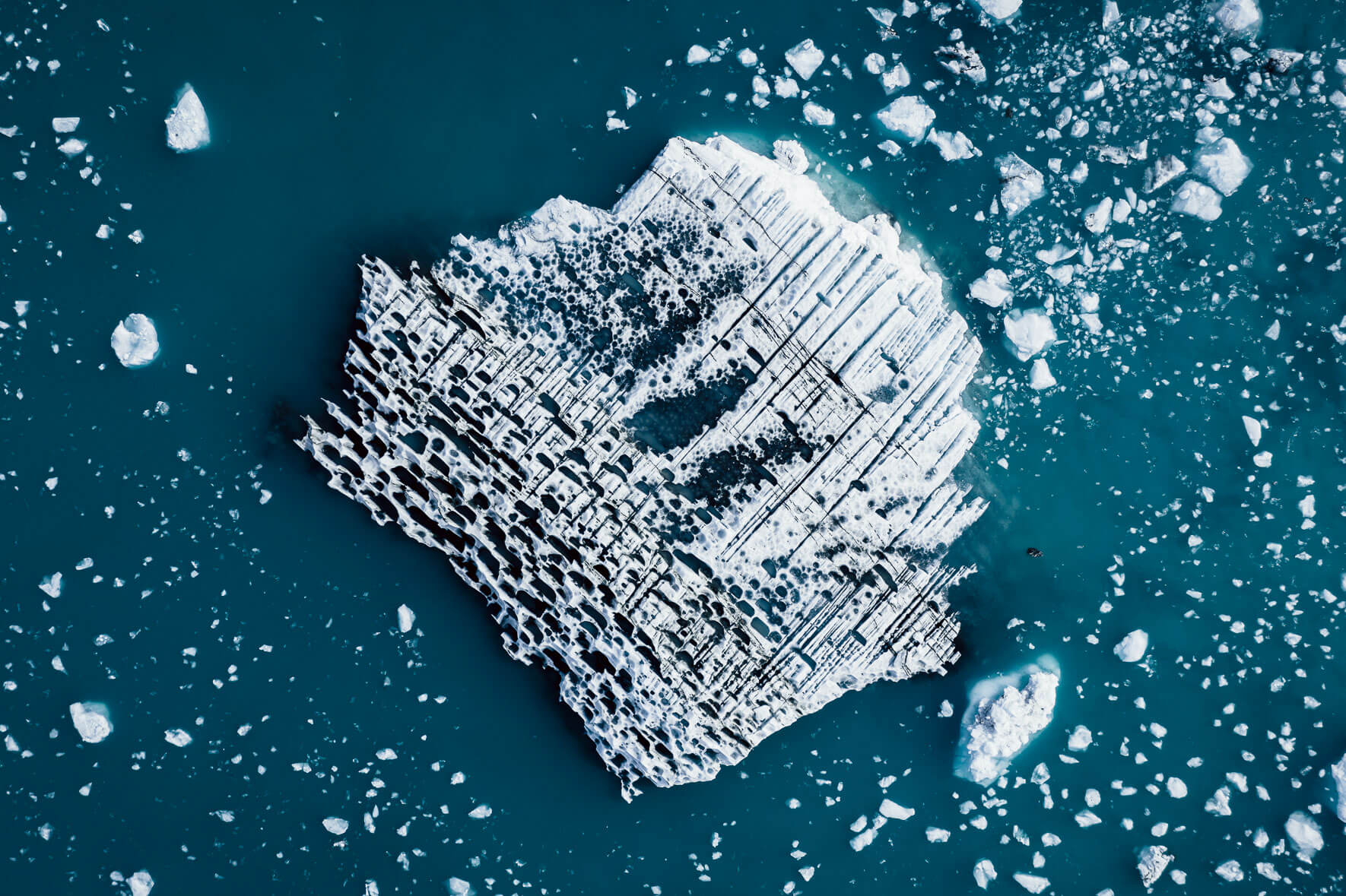 Aerial photography of abstract icebergs in glacier lagoon in Iceland
