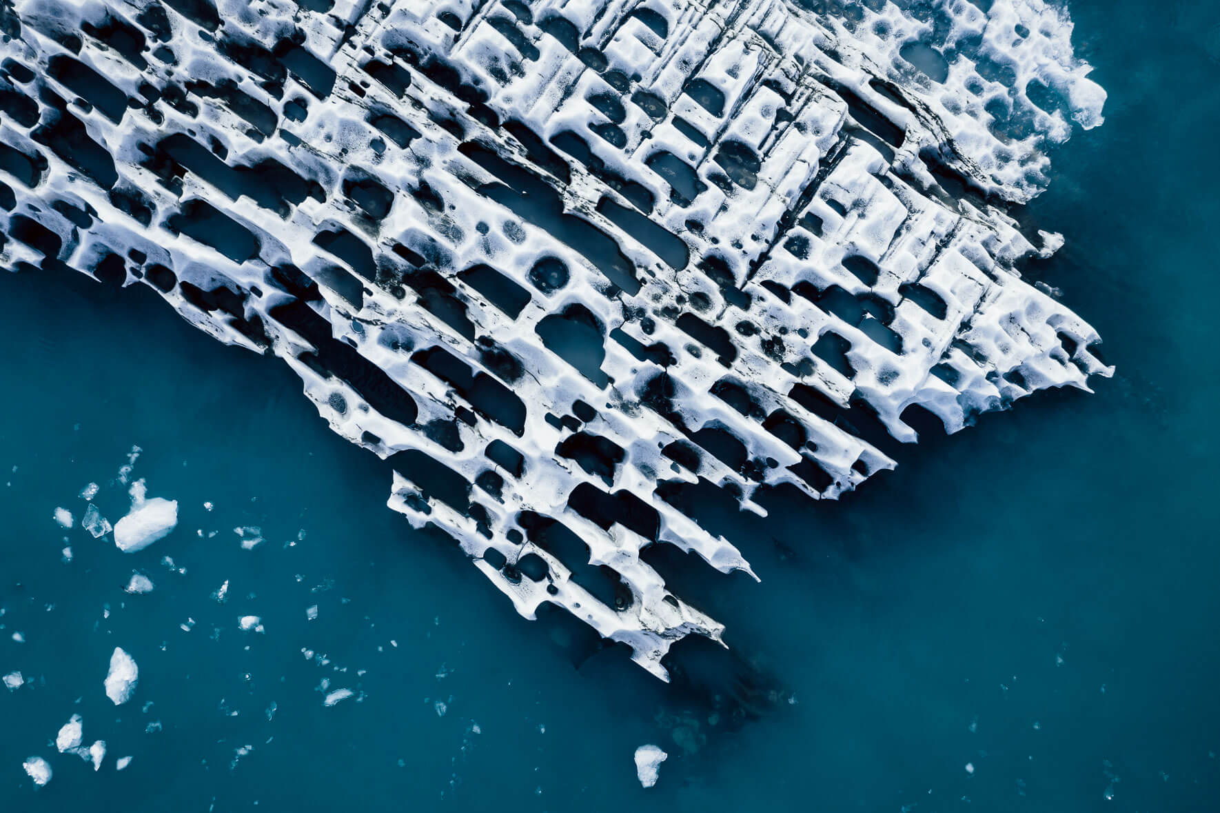 Aerial photograph of icebergs with abstract patterns in glacier lagoon in Iceland