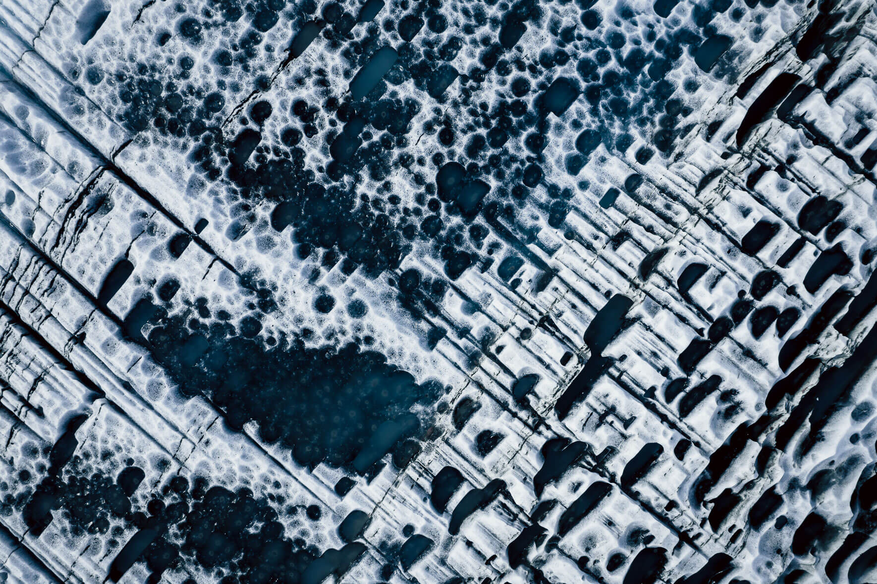 Icebergs with abstract patterns in a glacier lagoon in Iceland
