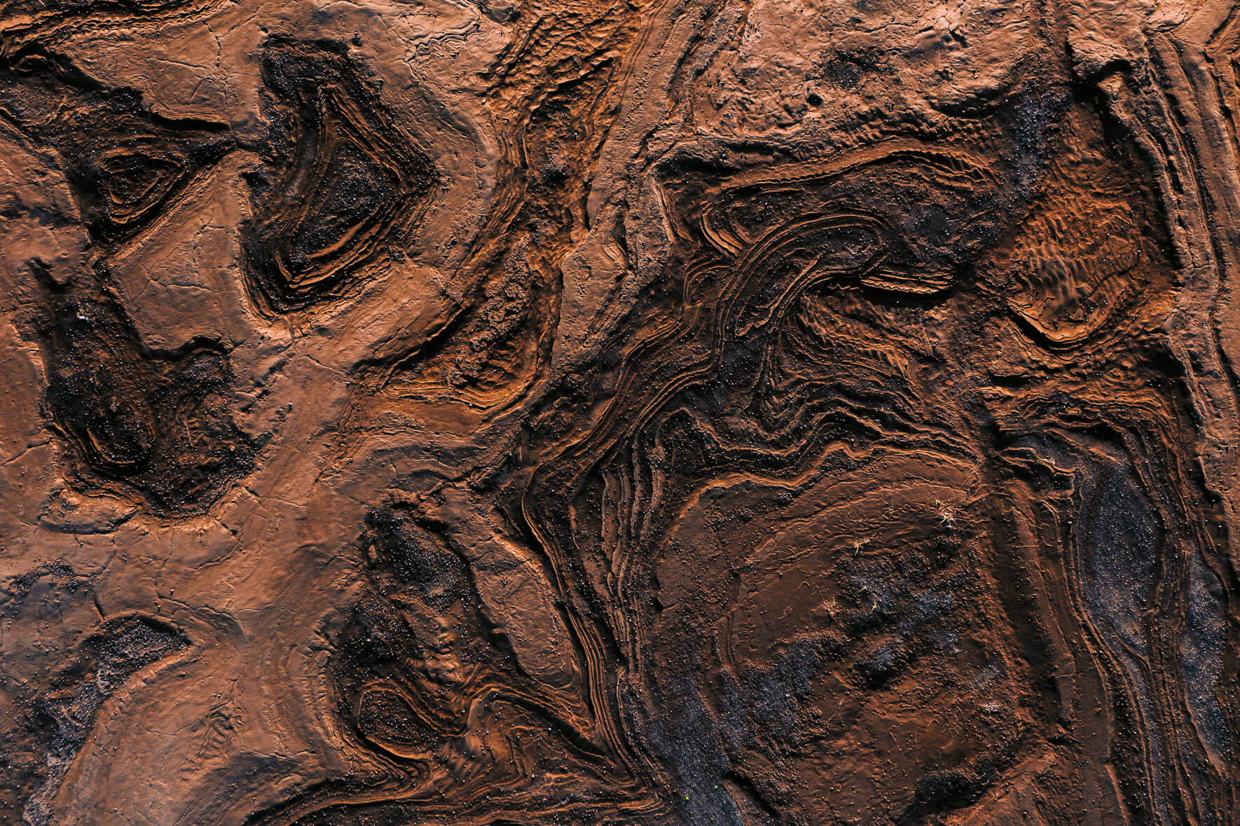 Abstract rock and sand formations from an aerial perspective in Iceland