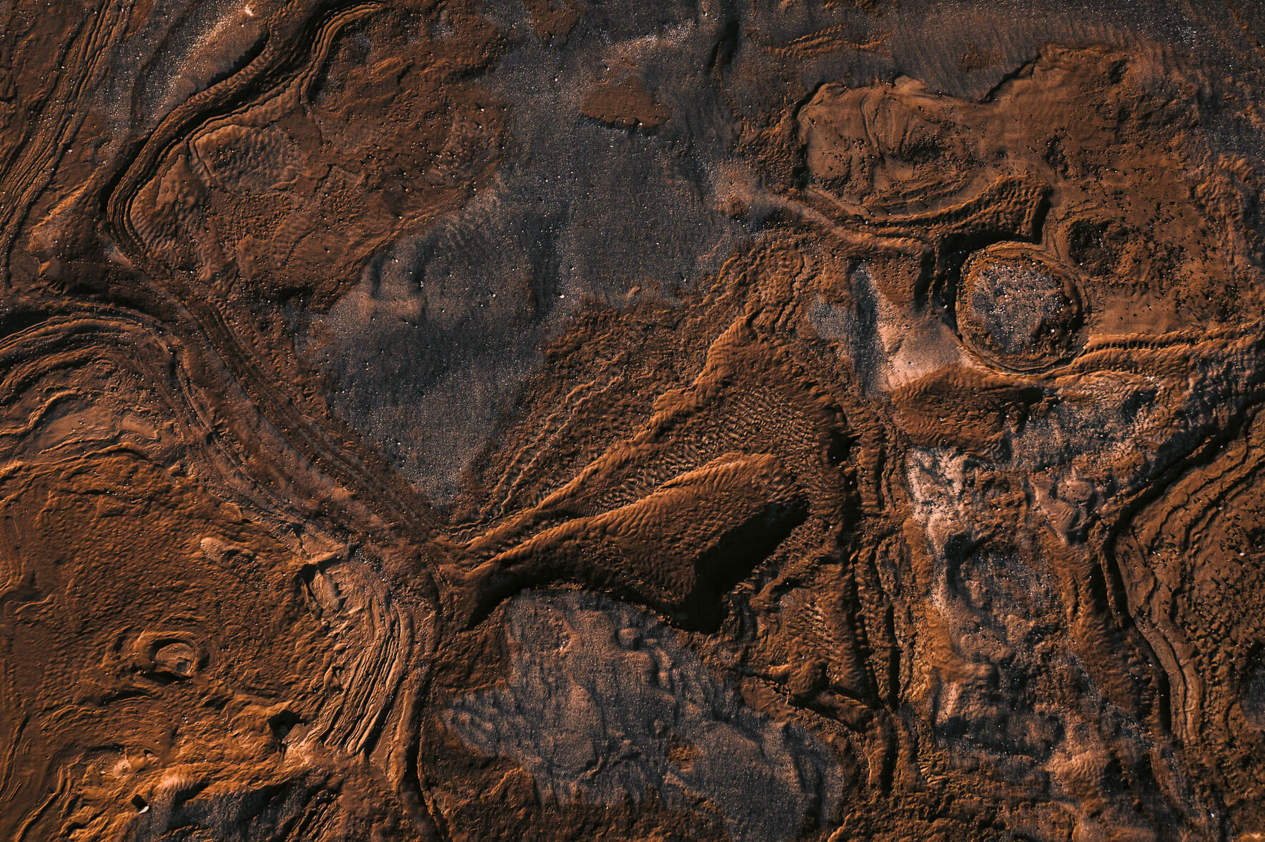Abstract rock and sand formations from an aerial perspective