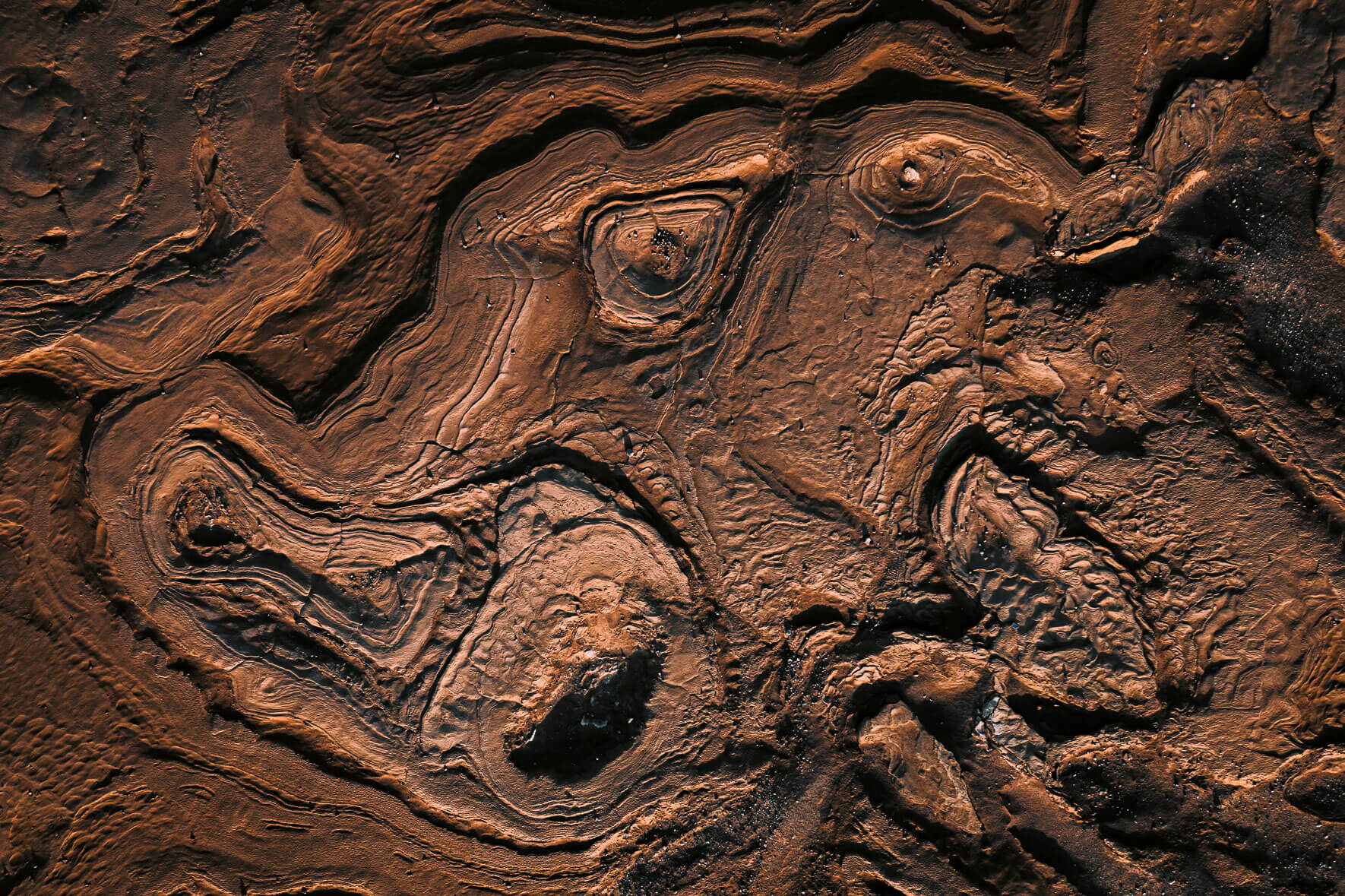 Abstract rock and mud formations from an aerial perspective in Iceland