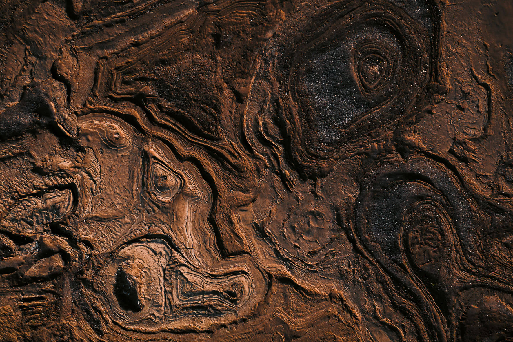 Abstract mud and sand textures from an aerial perspective in Iceland