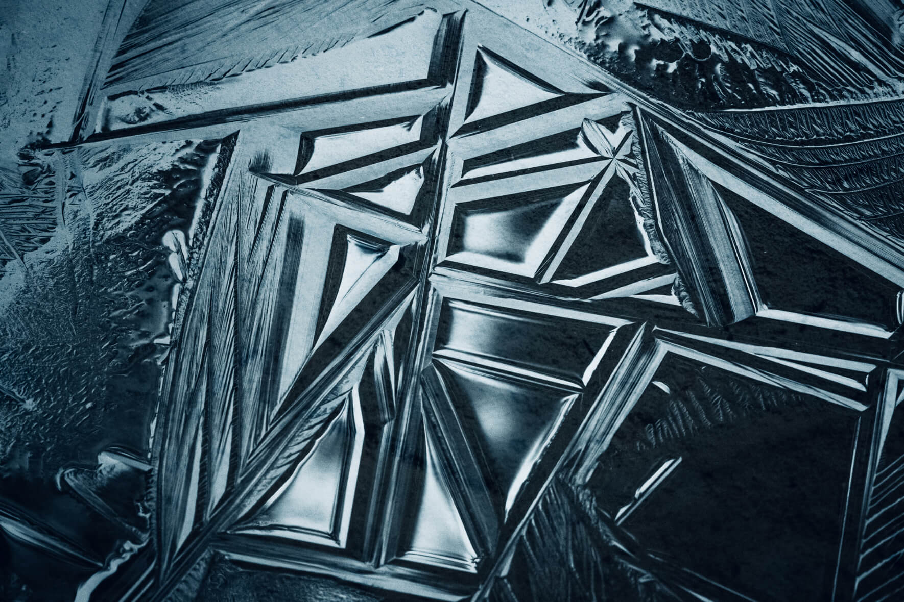 Abstract geometric lines in the surface of a frozen lake