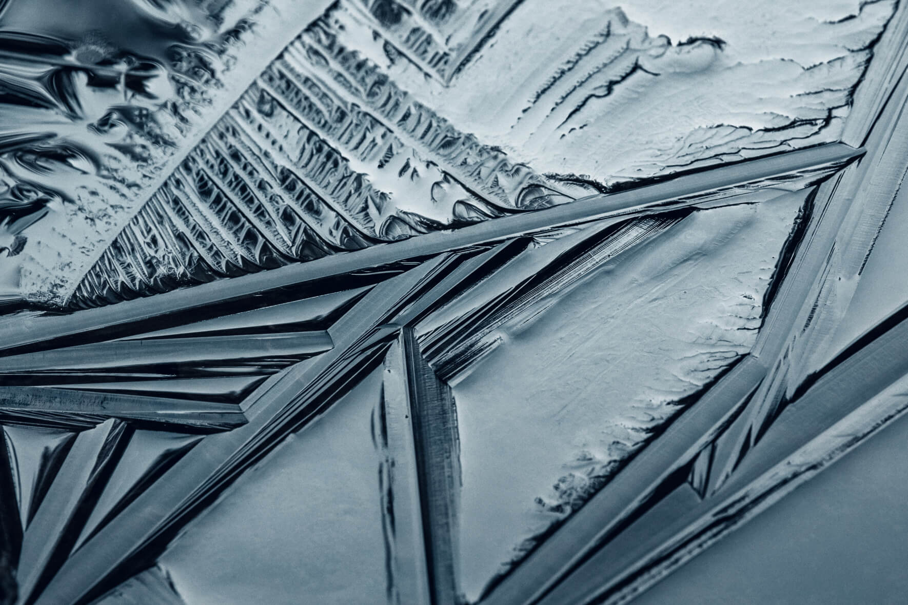 Abstract geometric lines in the surface of a frozen lake