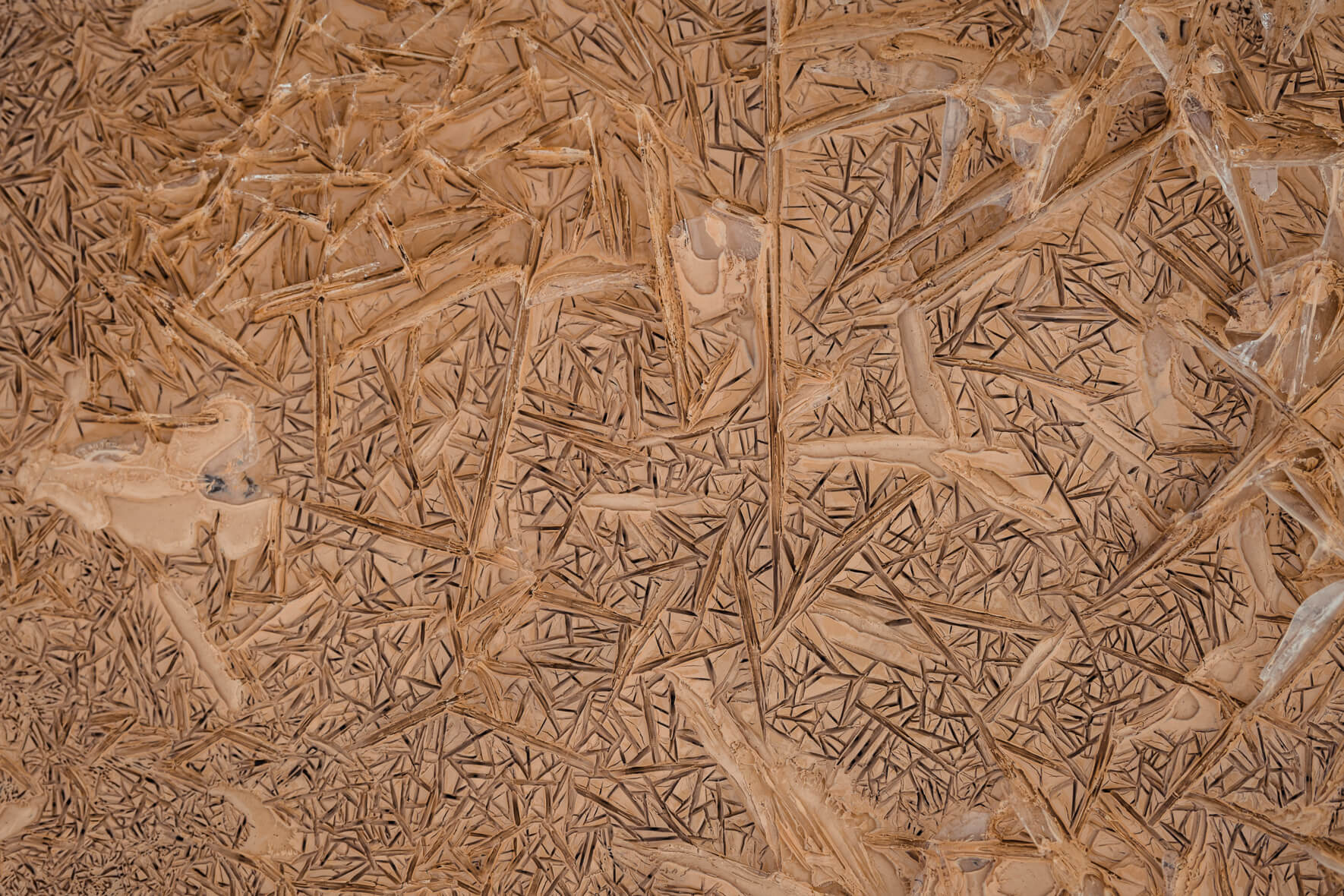 Ice crystals in a frozen and muddy creek in Iceland